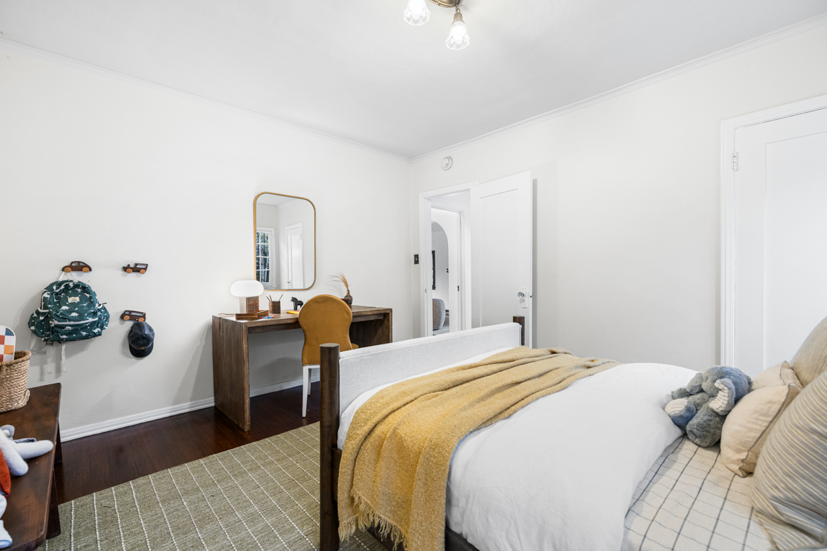 926 Burnside Avenue Los Angeles, CA 90036 - Photo 34 of 71 a bedroom with bed and wooden floor