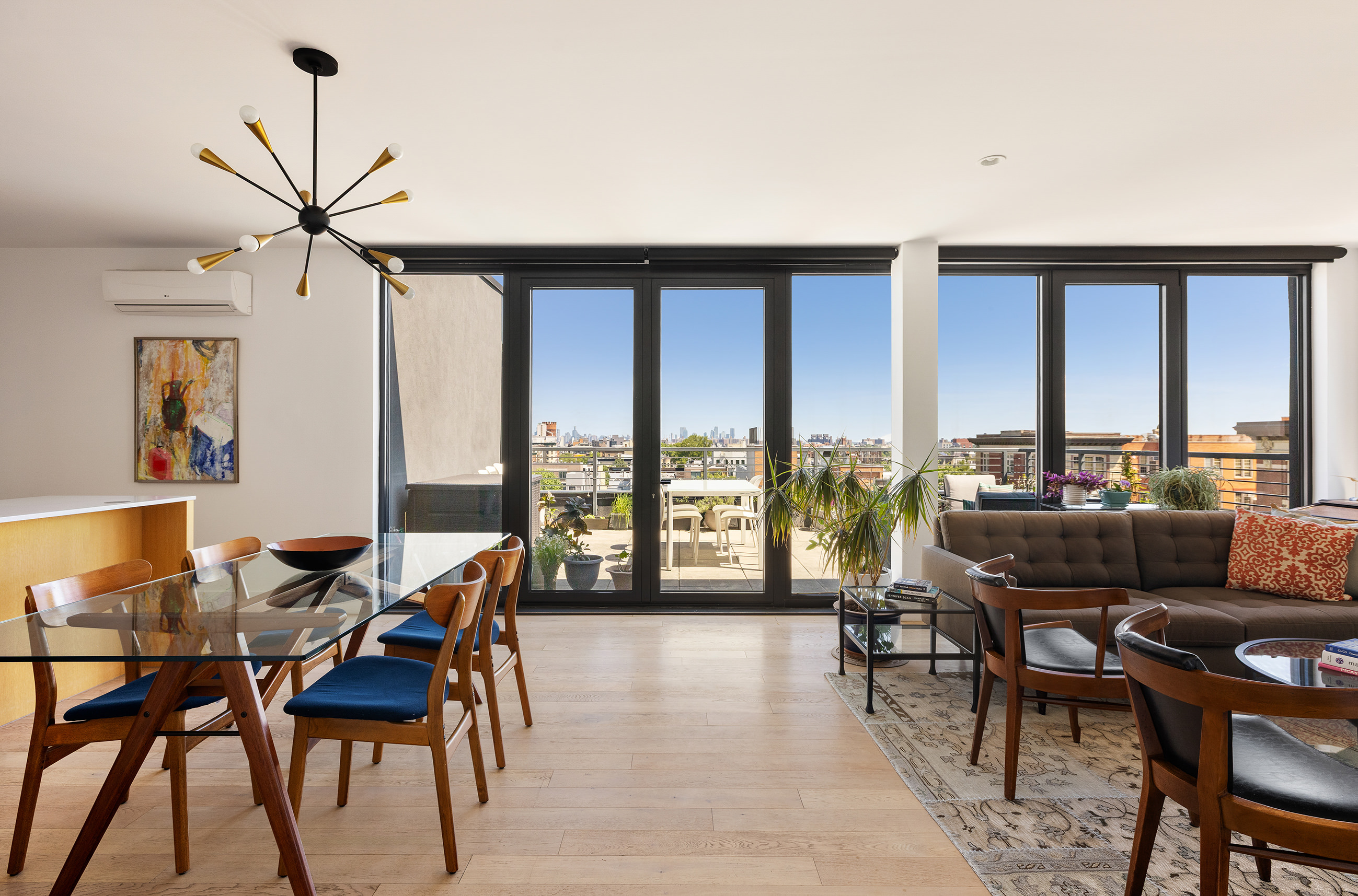 762 Park Place, Unit PH1 Brooklyn, NY 11216 - Photo 11 of 15 a living room with furniture and floor to ceiling windows