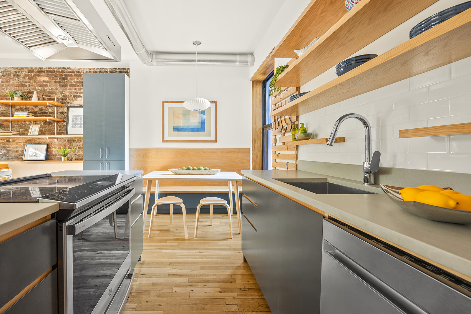 149 Clinton Avenue, Unit 1B Brooklyn, NY 11205 - Photo 5 of 9 a view of a kitchen with granite countertop a sink and a stove