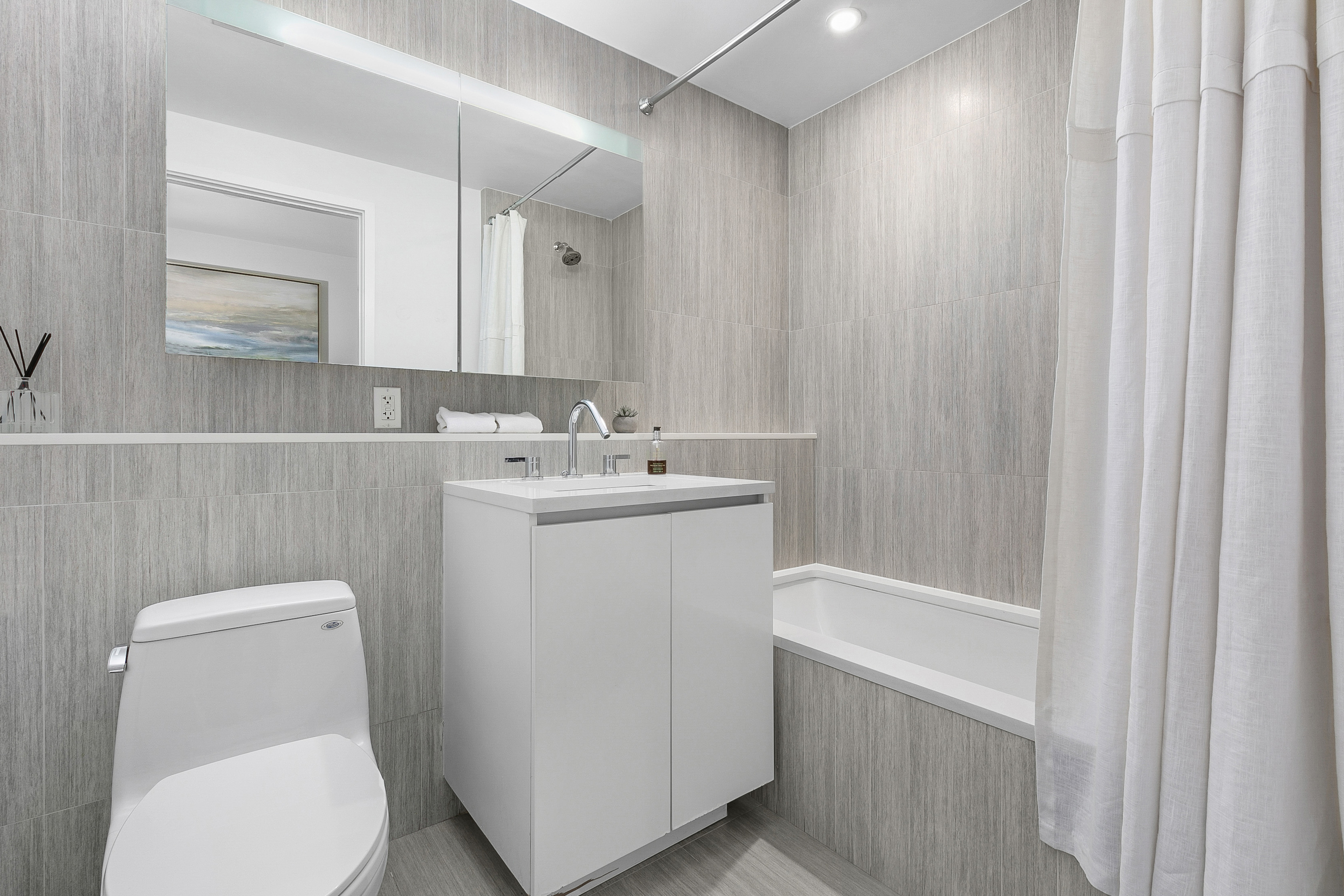 50 Franklin Street, Unit 9A Manhattan, NY 10013 - Photo 5 of 7 a view of bathroom with a toilet sink and mirror