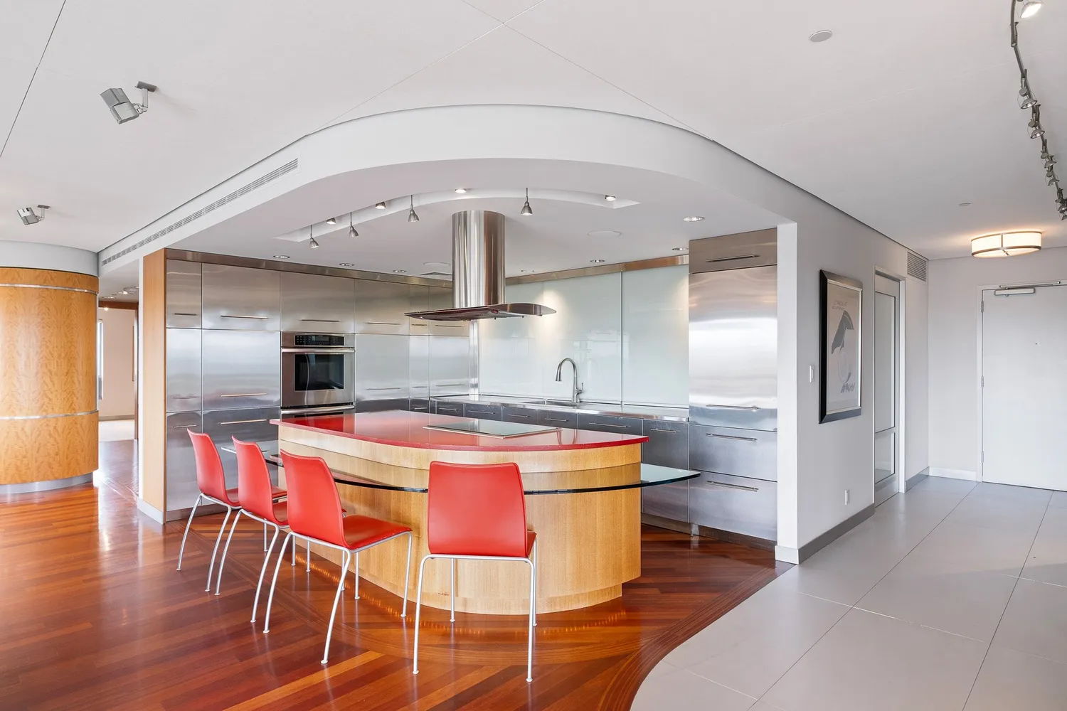 a white toilet sitting next to a bathroom sink