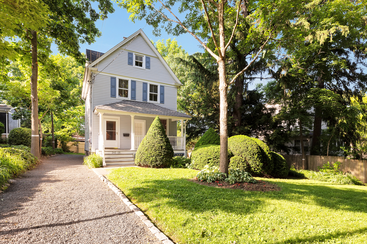 242-09 Pine Street Queens, NY 11363 - Photo 15 of 21 a view of a house with backyard and a tree