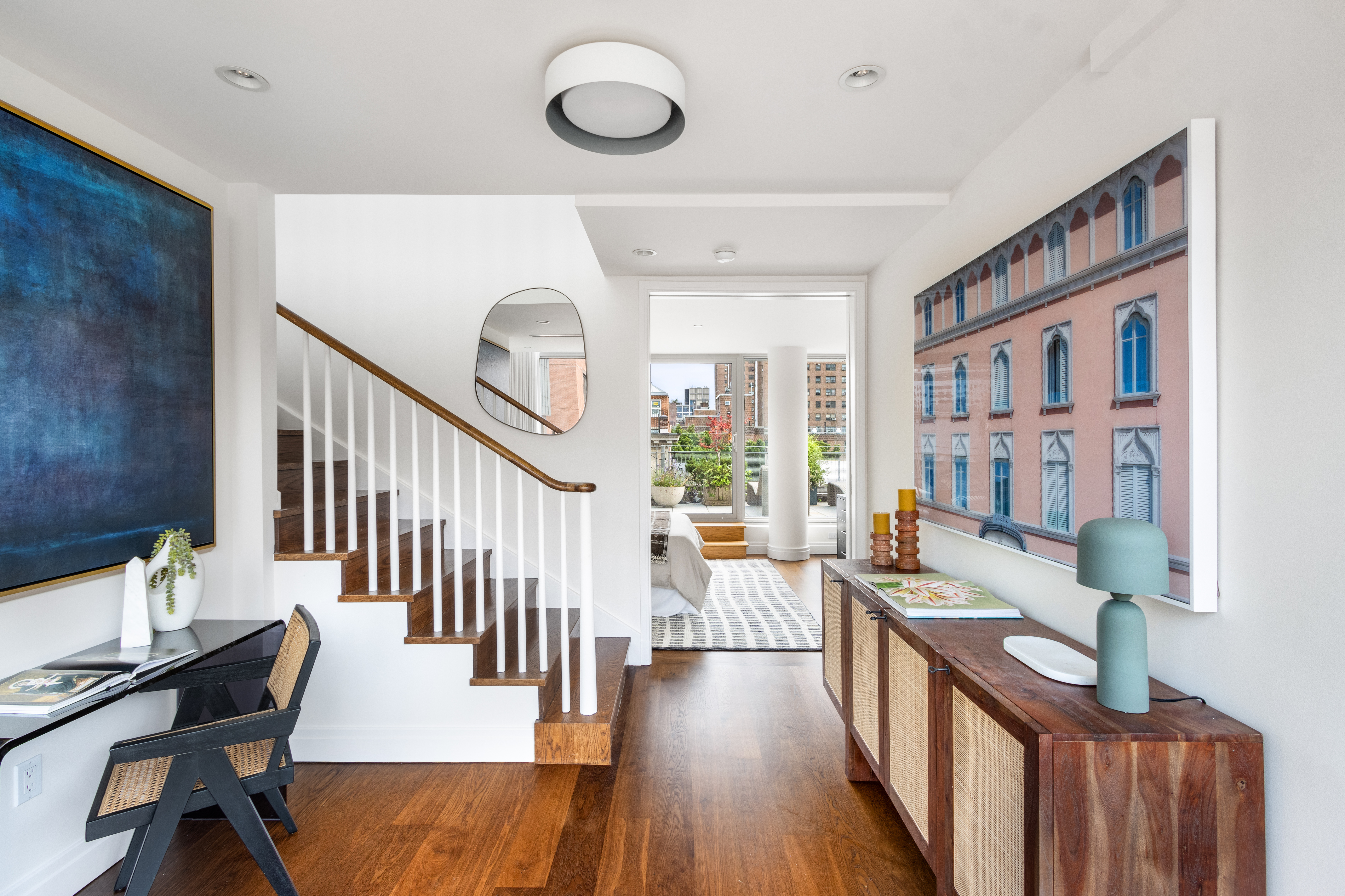 177 9th Avenue, Unit PHA Manhattan, NY 10011 - Photo 4 of 28 a living room with furniture and a wooden floor
