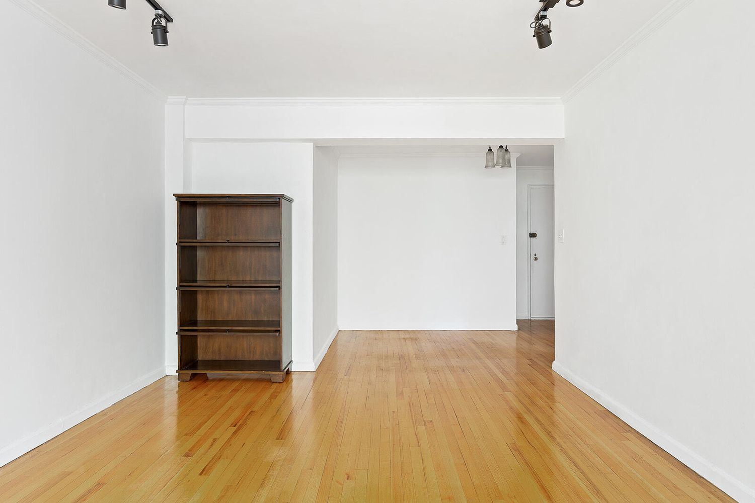 302 East 88th Street, Unit 3F Manhattan, NY 10128 - Photo 3 of 6 a view of empty room with wooden floor