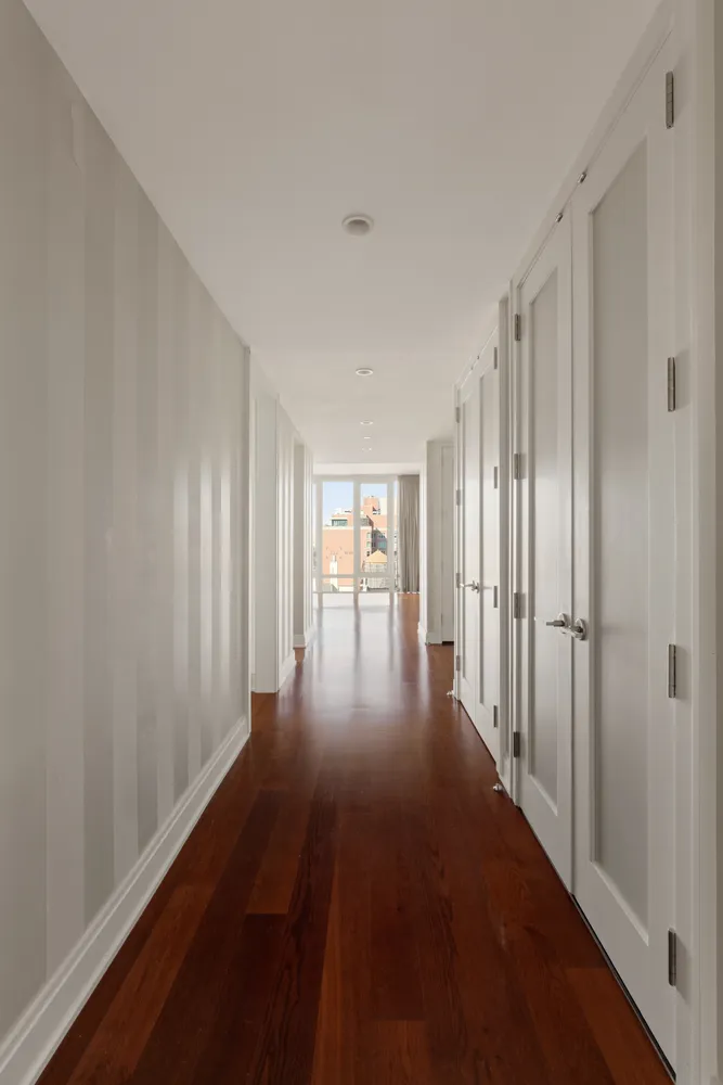a view of entryway with wooden floor