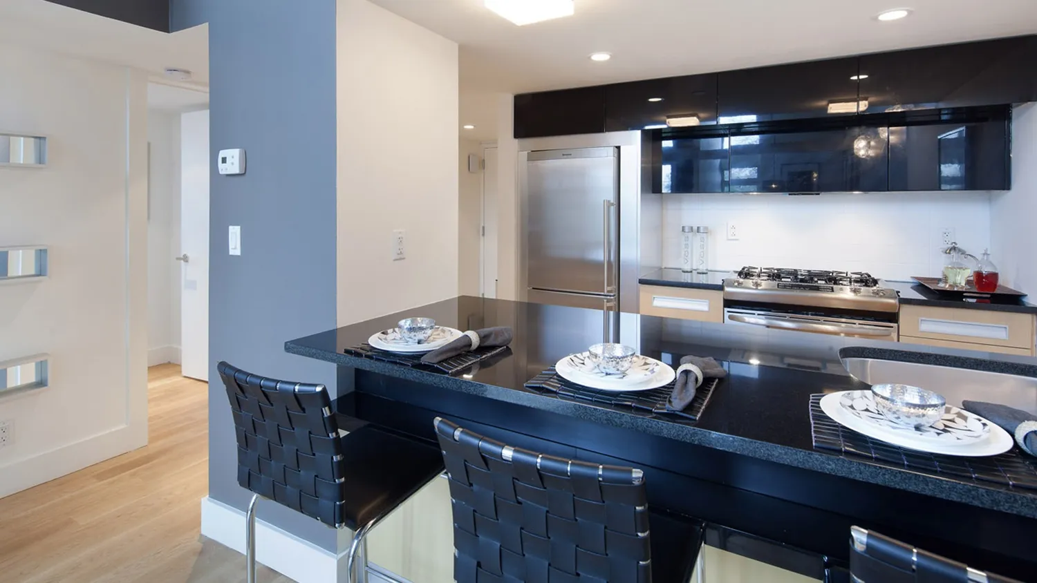 a kitchen with a table and chairs in it