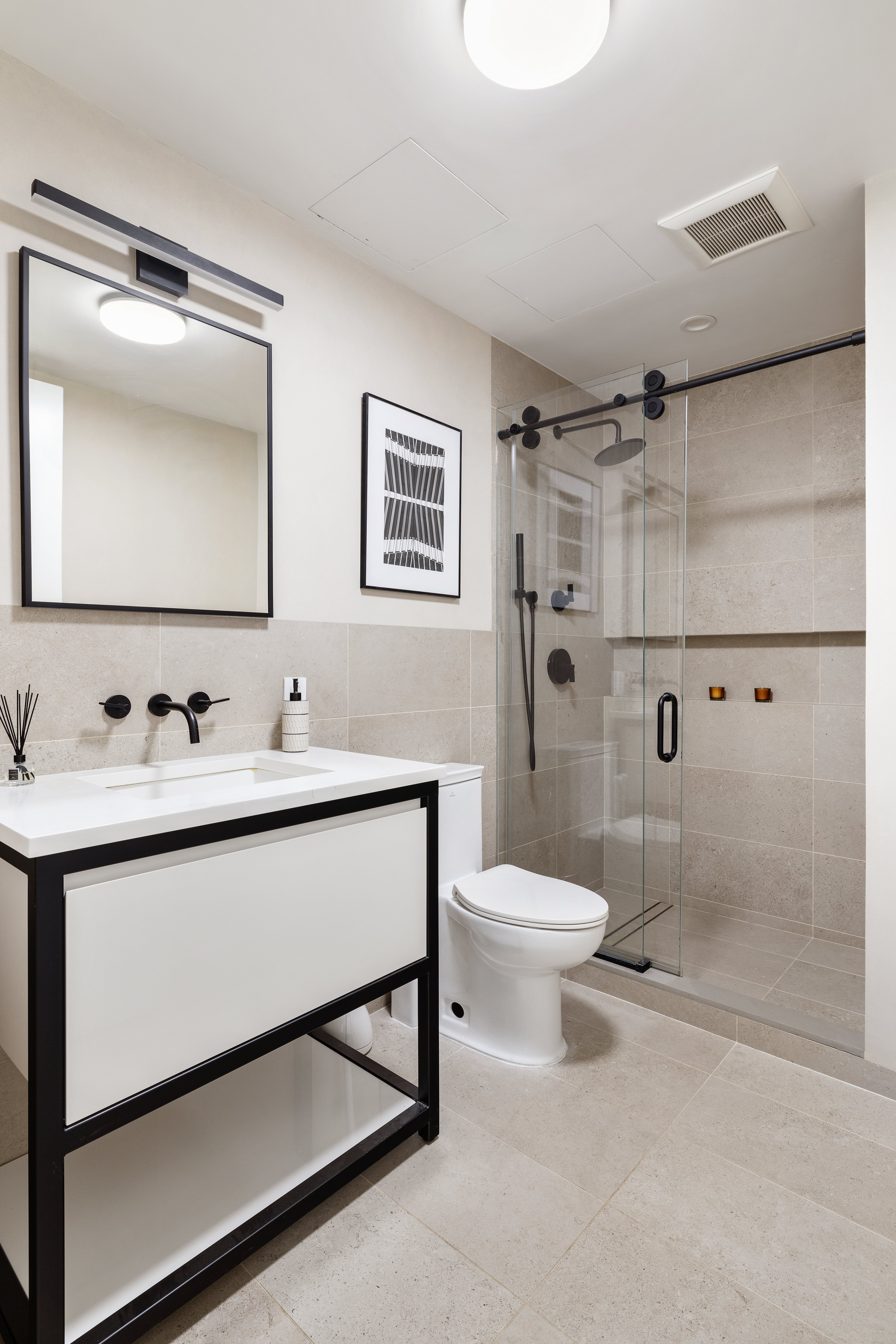 24 West 30th Street, Unit 6 Manhattan, NY 10001 - Photo 12 of 14 a bathroom with a sink toilet and shower