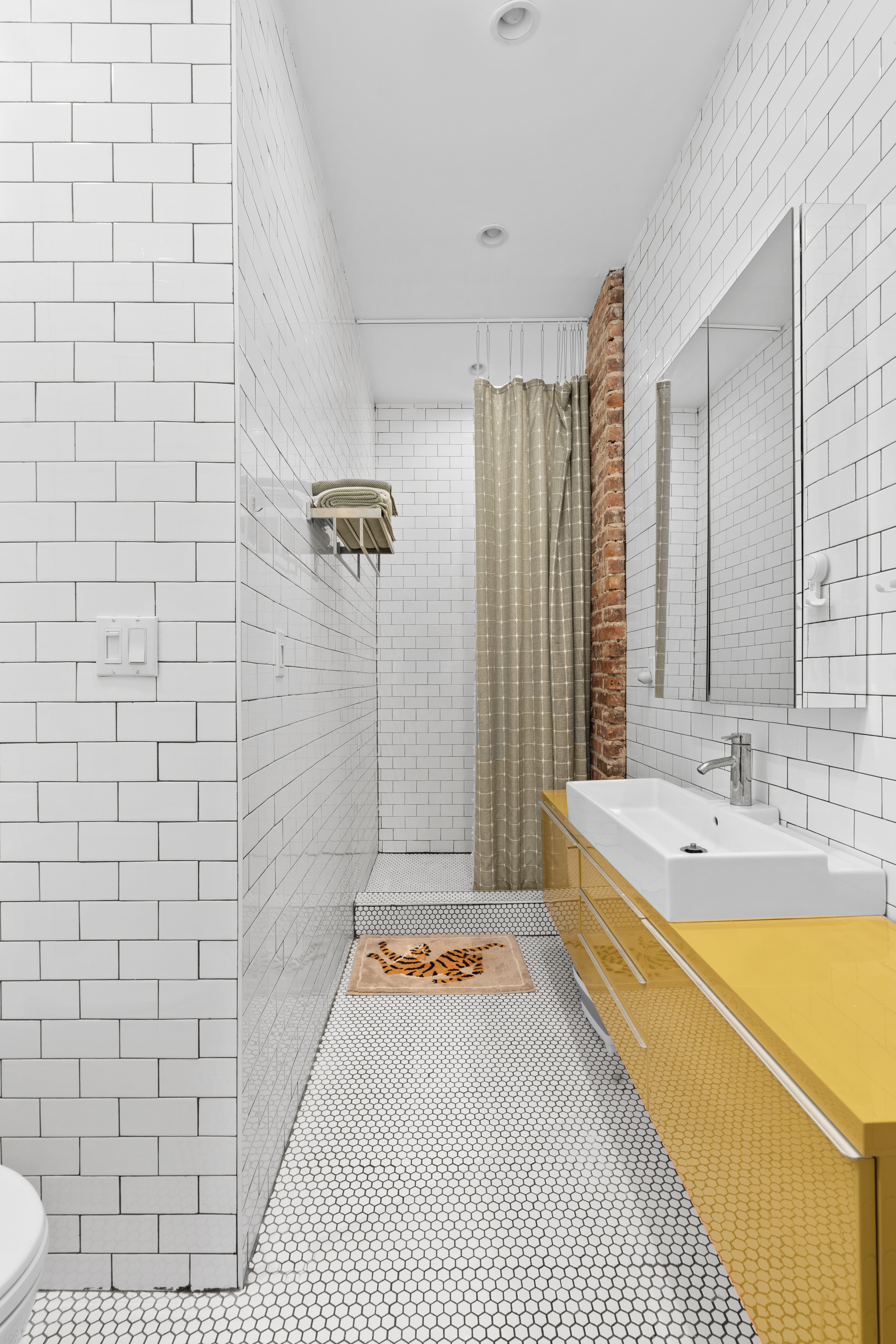 660 Saint Marks Avenue Brooklyn, NY 11216 - Photo 12 of 21 a bathroom with a sink a toilet and shower