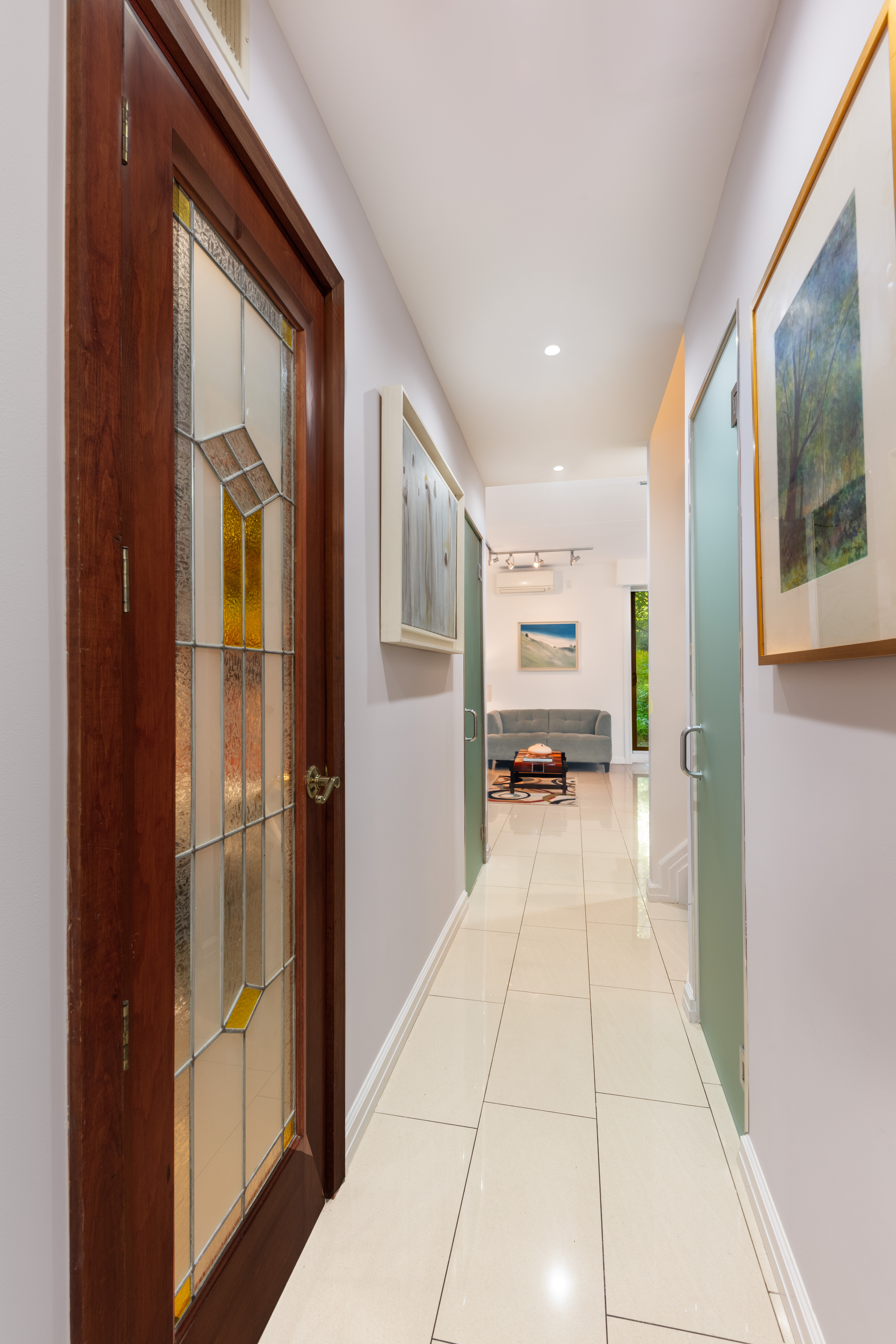 129 Barrow Street, Unit GA Manhattan, NY 10014 - Photo 3 of 17 a view of a hallway with wooden floor windows and livingroom