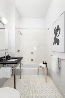 a bathroom with a sink a toilet and a bathtub