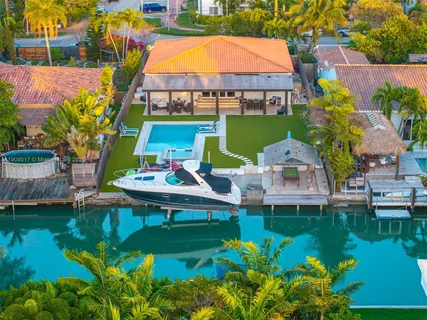 an aerial view of residential building and lake