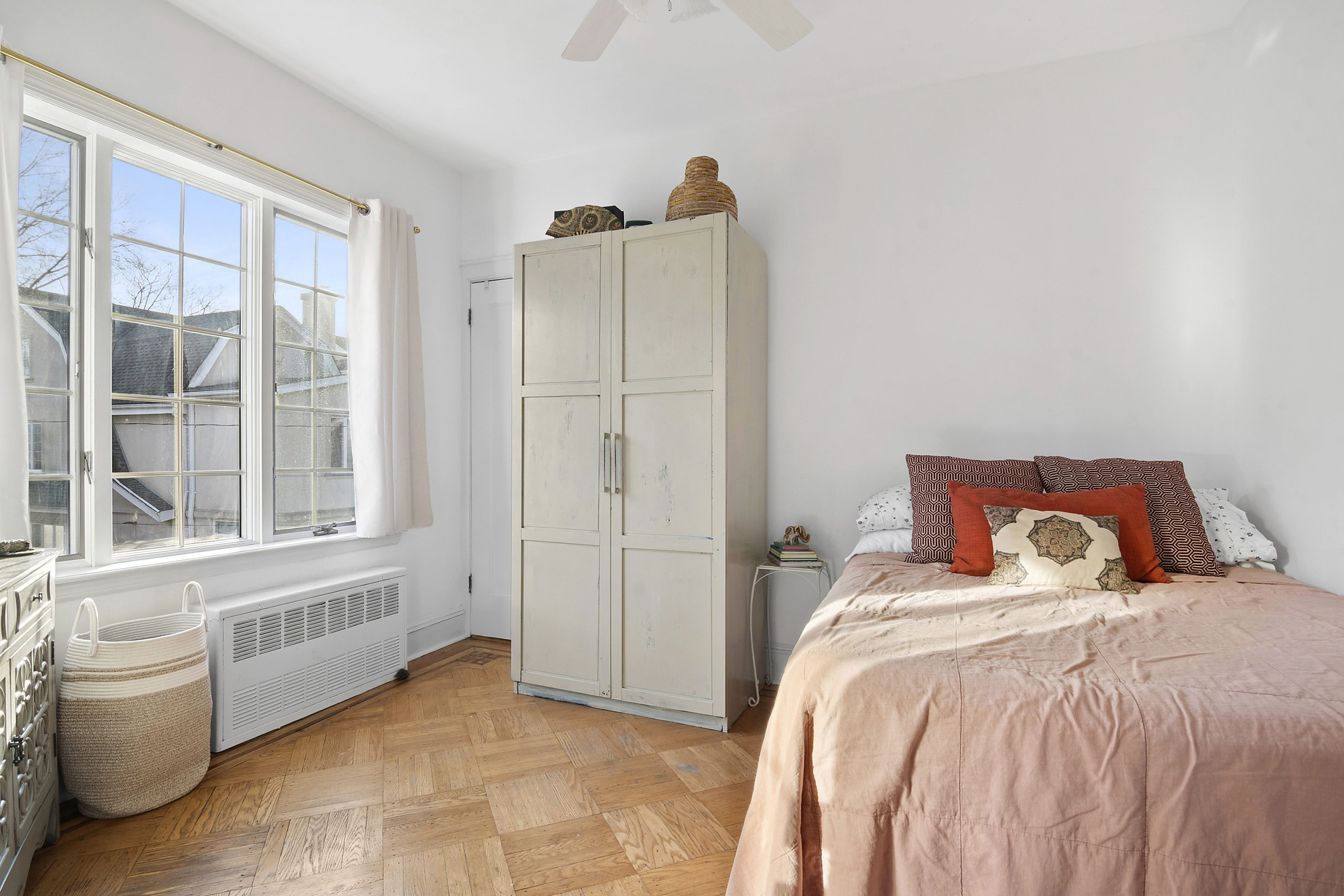 1384 East 29th Street Brooklyn, NY 11210 - Photo 8 of 21 a bedroom with a bed and a large window