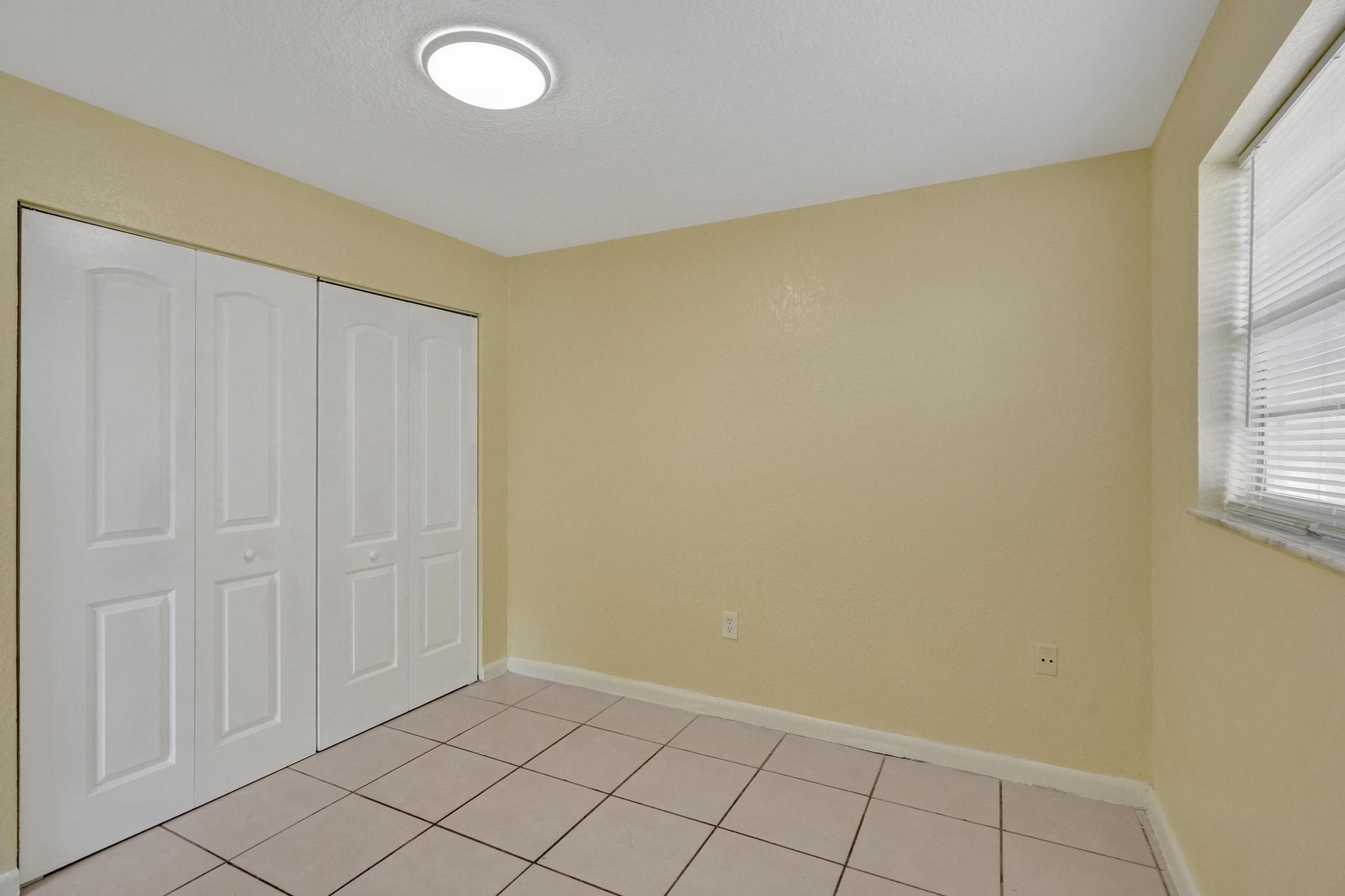 1101 Prospect Road Fort Lauderdale, FL 33309 - Photo 11 of 34 an empty room with windows