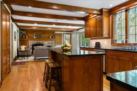 a view of a dining room with furniture and window