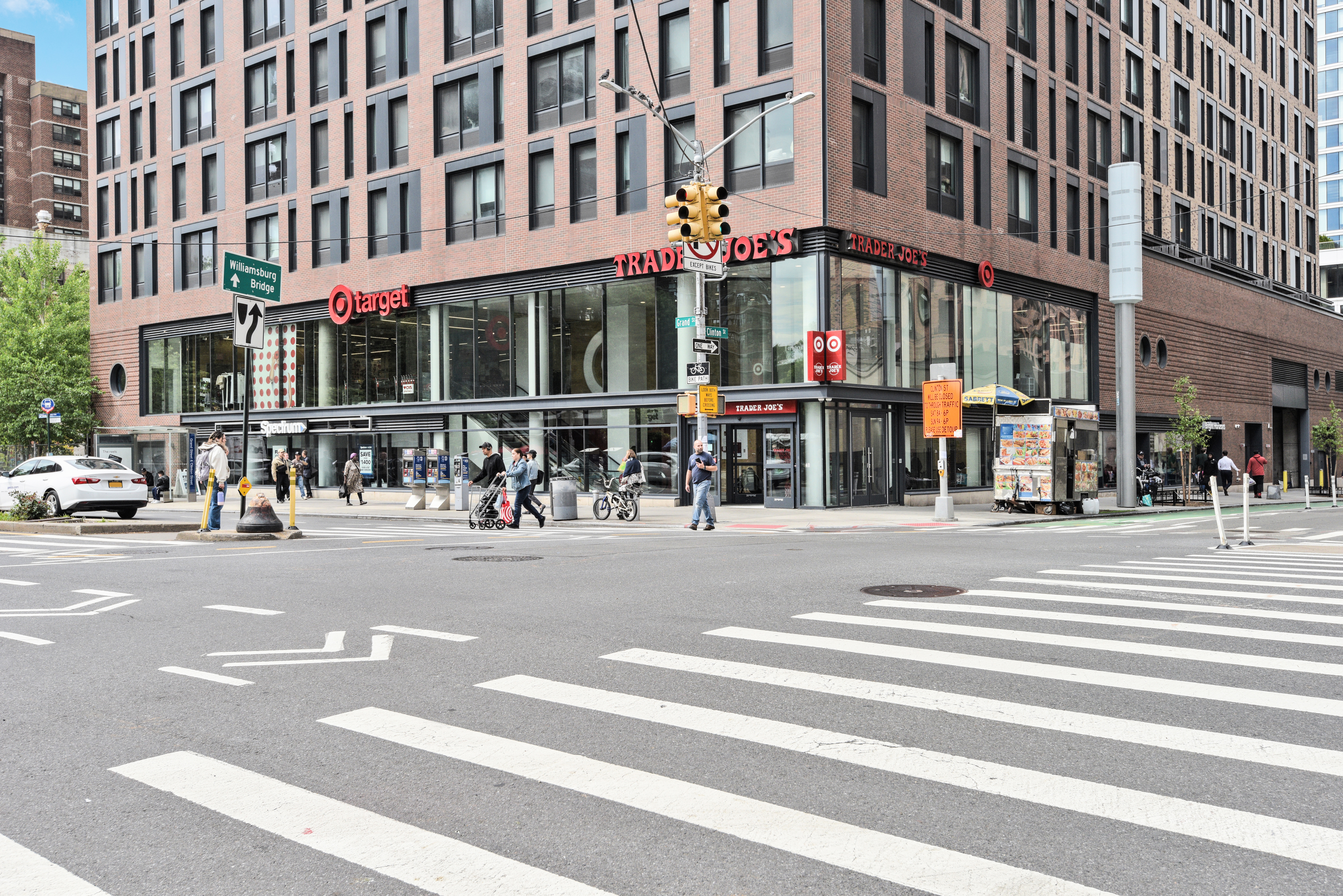 208 East Broadway, Unit J1304 Manhattan, NY 10002 - Photo 15 of 19 a view of a building on a street