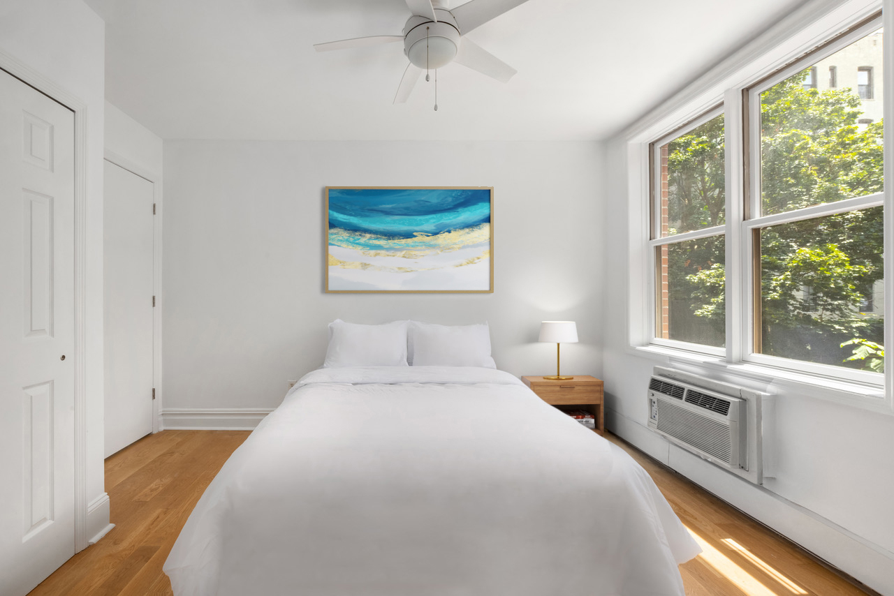 150 South 1st Street, Unit 2K Brooklyn, NY 11211 - Photo 4 of 12 a bedroom with a large bed and a large window