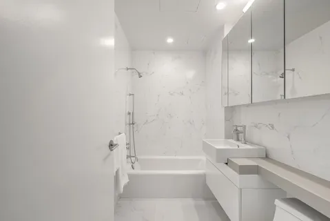 a bathroom with a bathtub and a sink