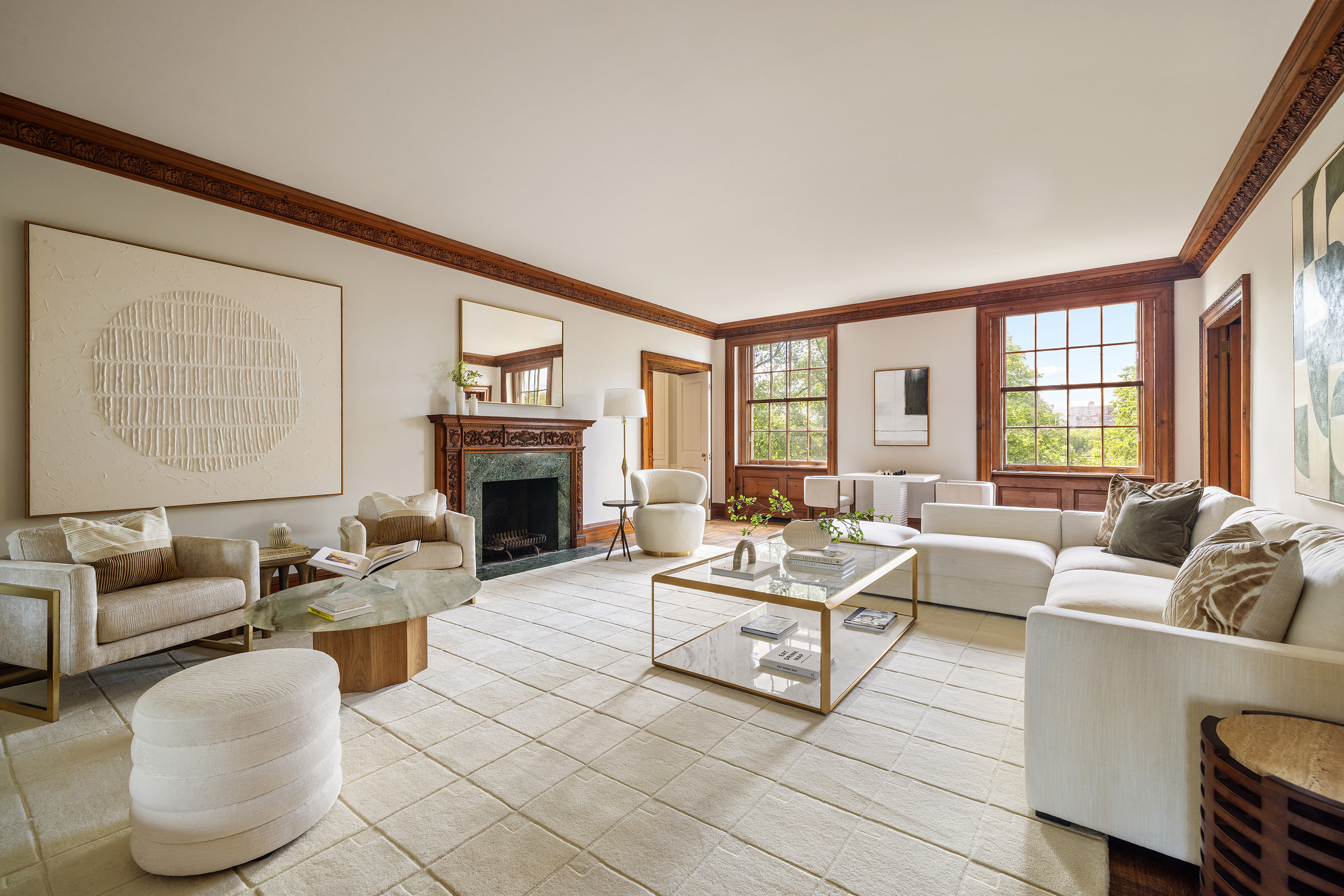 1120 5th Avenue, Unit 7B Manhattan, NY 10128 - Photo 1 of 17 a living room with furniture and a fireplace