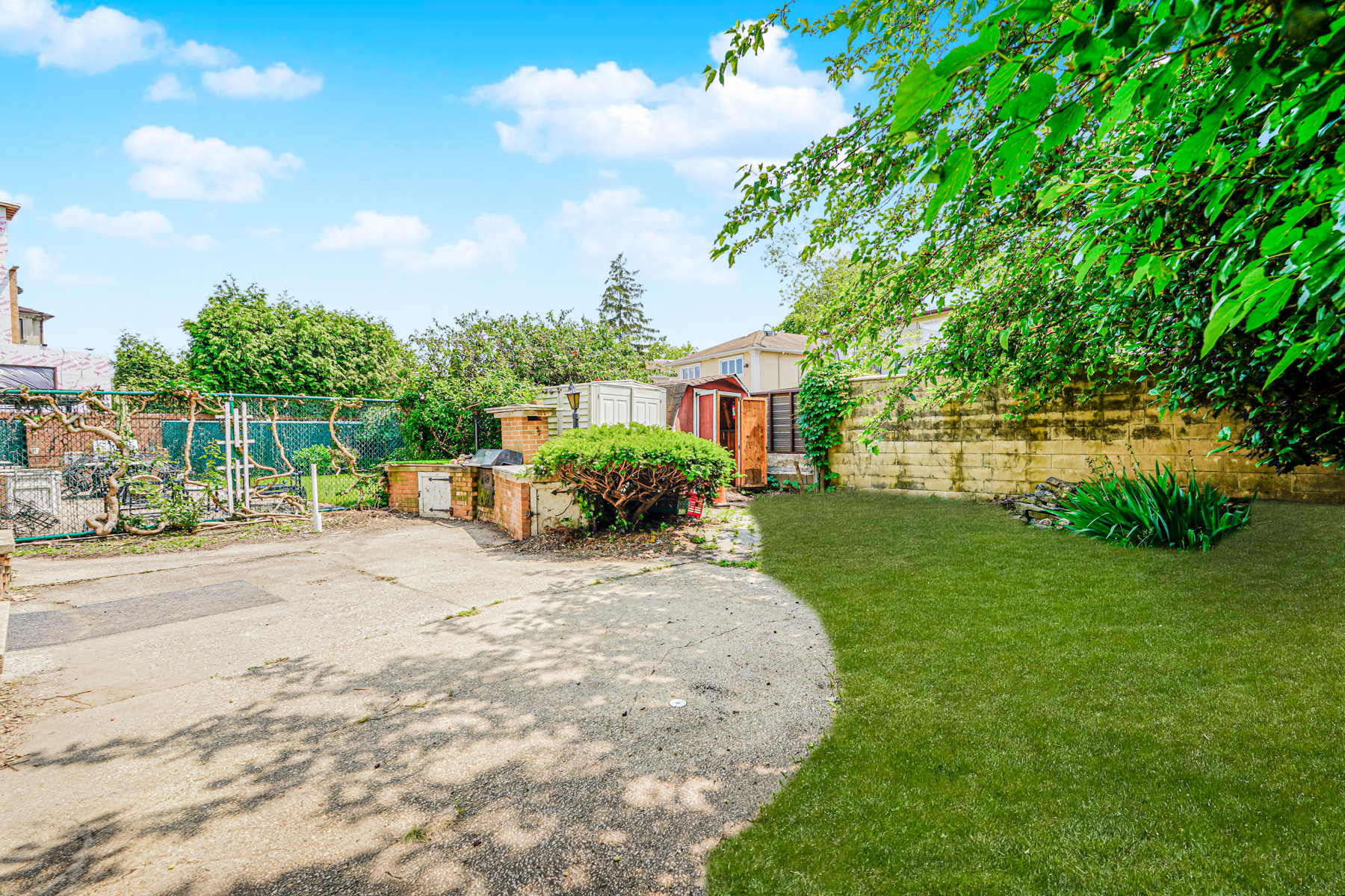 461 Mayfair Drive South Brooklyn, NY 11234 - Photo 26 of 30 a front view of a house with a yard and potted plants