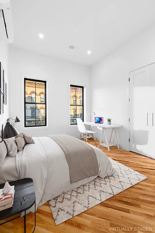 506 Woodward Avenue, Unit 1R Queens, NY 11385 - Photo 5 of 10 a bedroom with a bed and a window