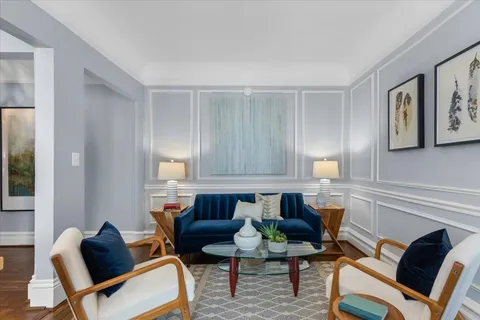 a kitchen with a table chairs stove and cabinets