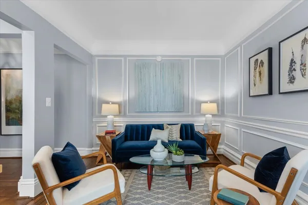 a kitchen with a table chairs stove and cabinets