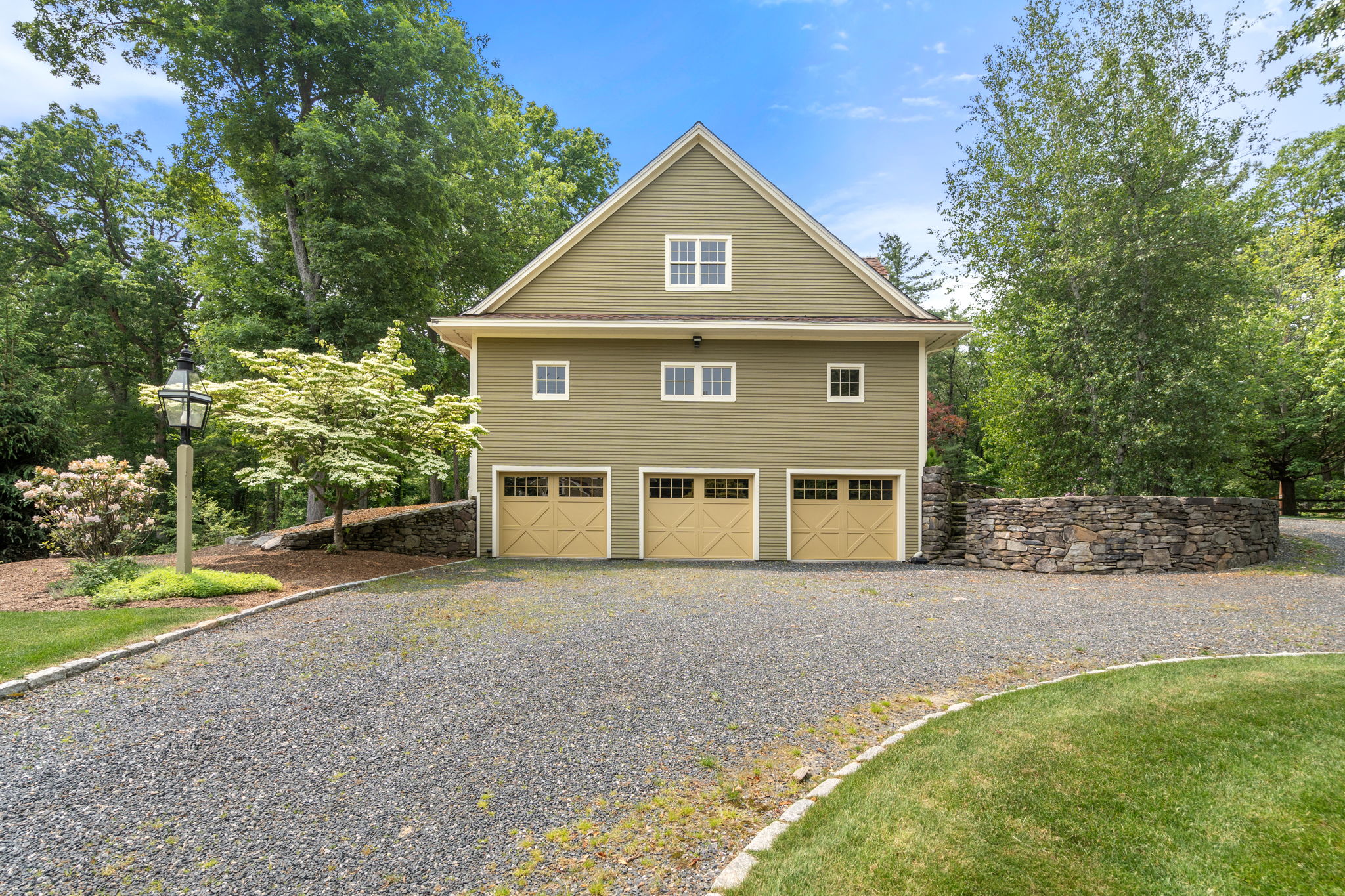 100 Farm Road Sherborn, MA 01770 - Photo 5 of 17 a front view of a house with a yard and garage