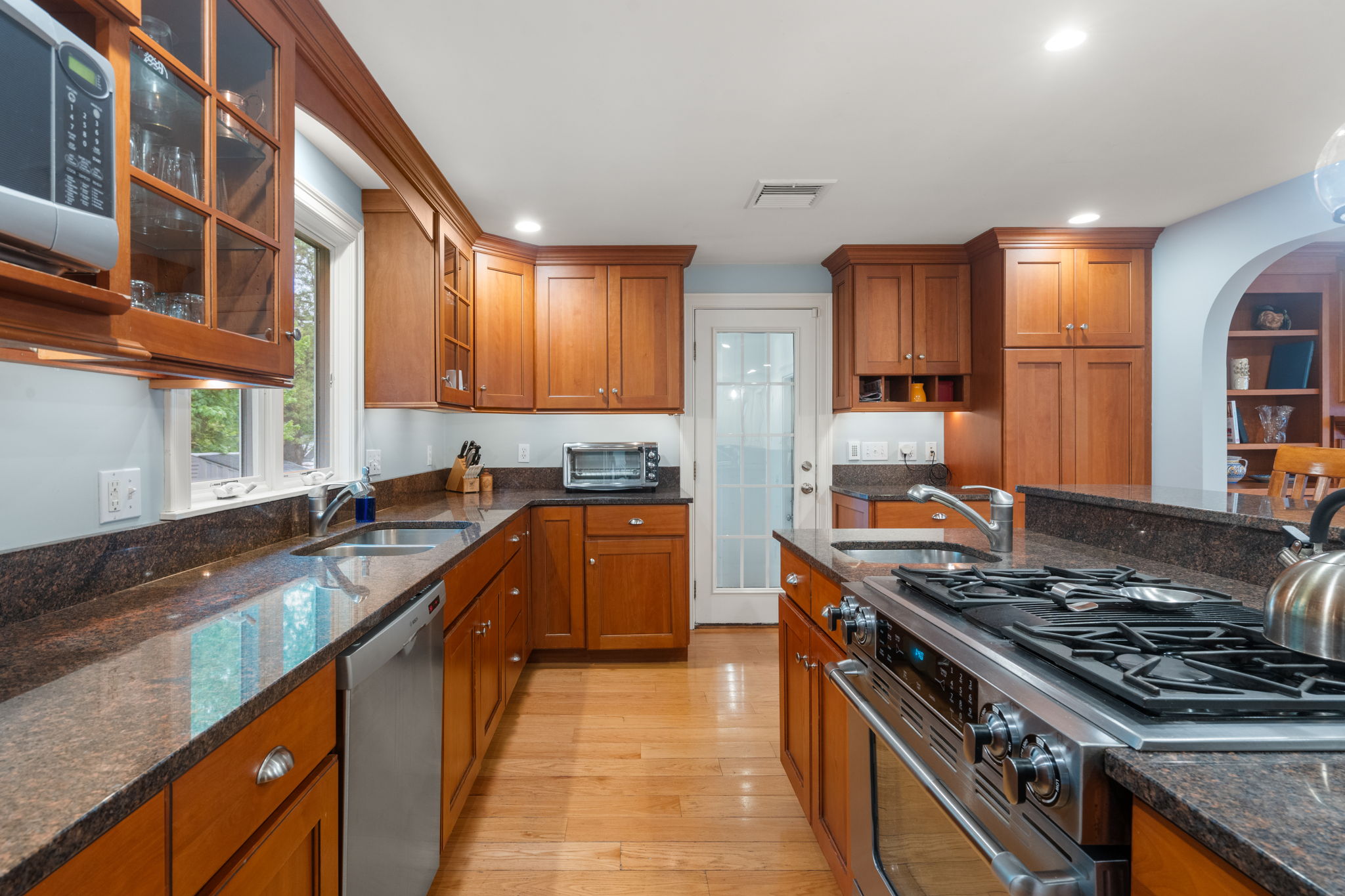 4 Gage Road Wayland, MA 01778 - Photo 9 of 32 a kitchen with stainless steel appliances granite countertop a stove and a sink