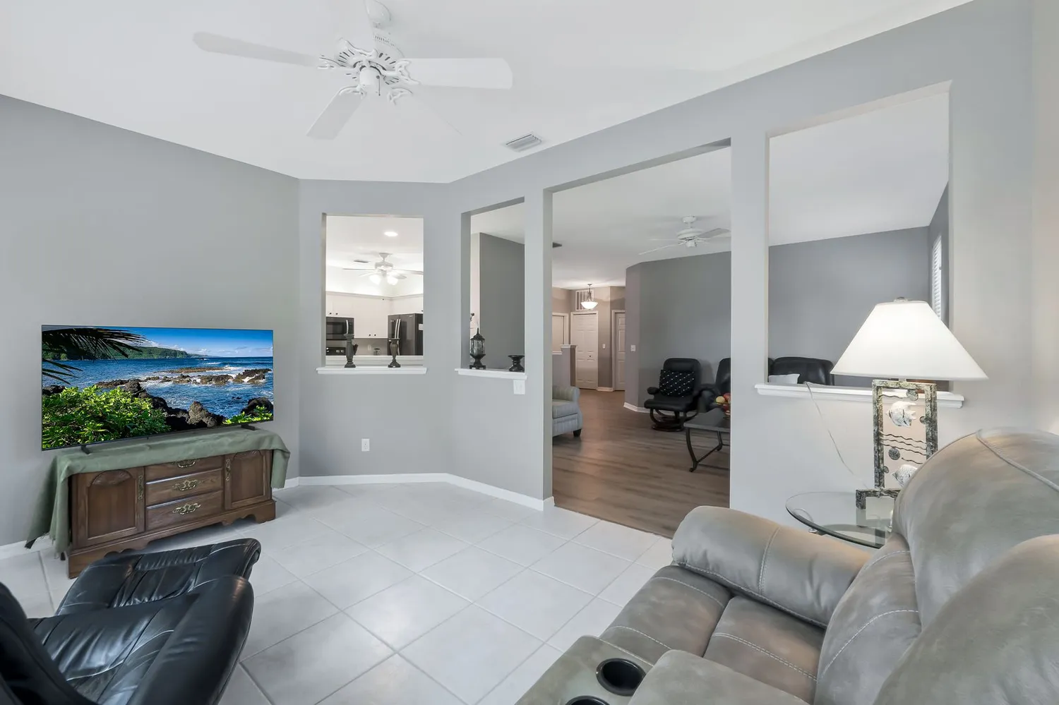 a kitchen that has a refrigerator and a sink