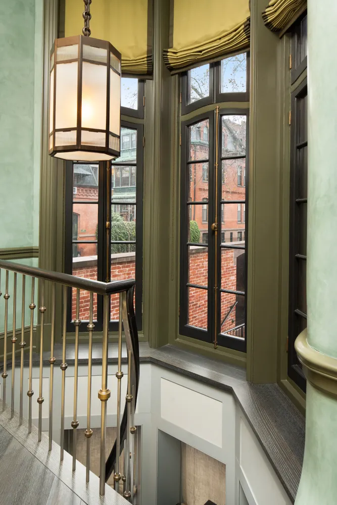 a view of a porch with a table and chairs