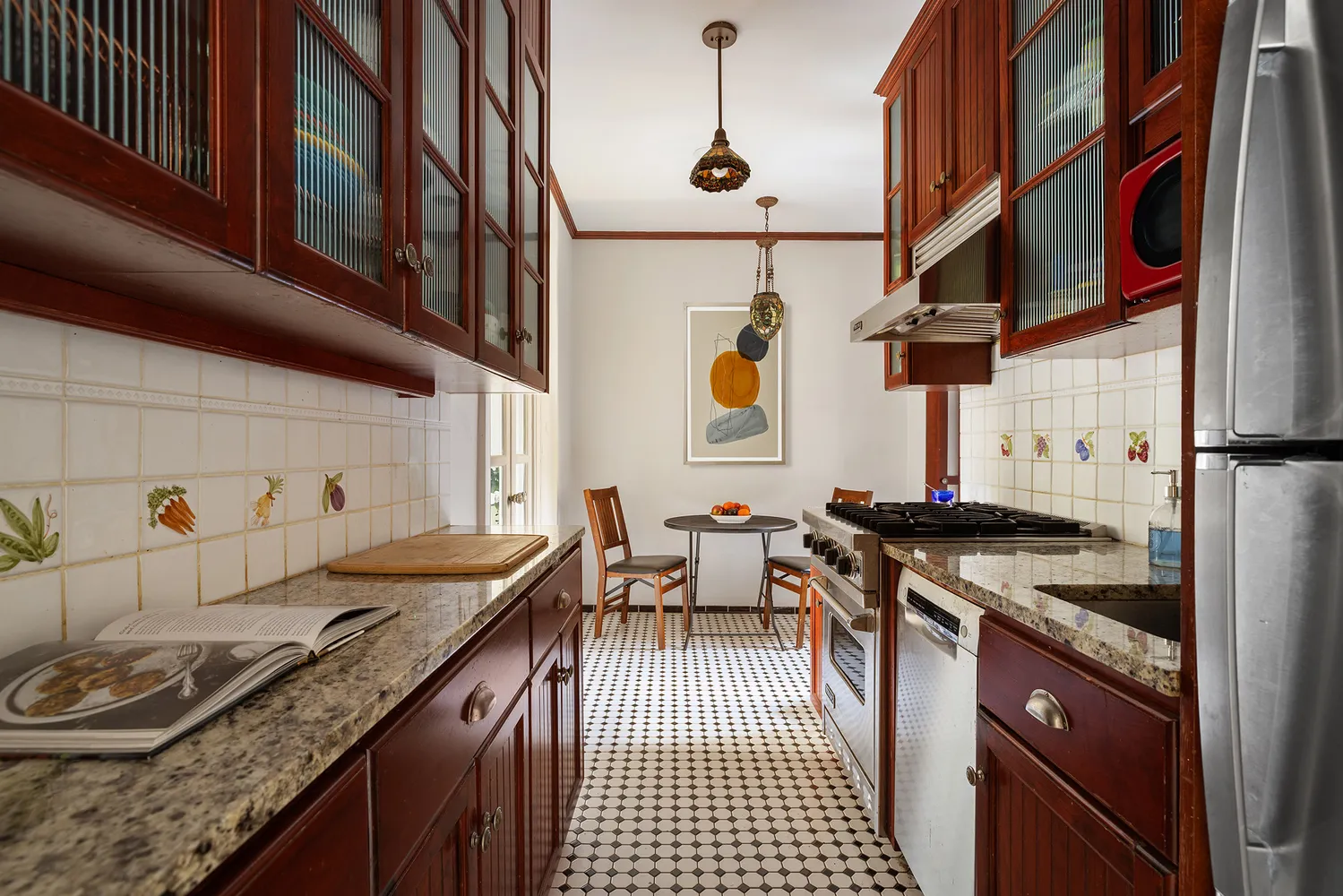 a kitchen with granite countertop lots of counter top space and stainless steel appliances