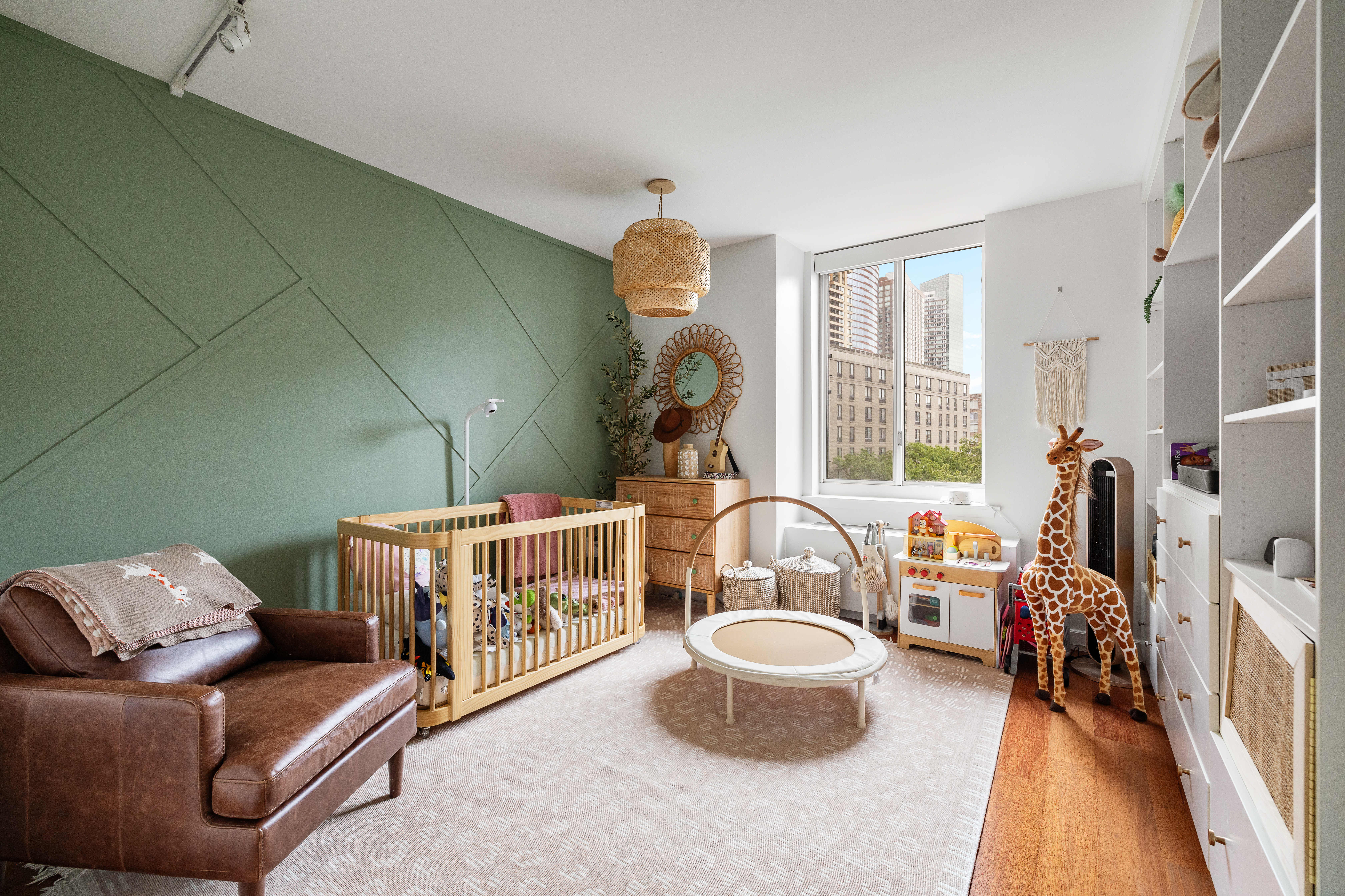 333 Rector Place, Unit 605 Manhattan, NY 10280 - Photo 6 of 13 a living room with furniture and a chandelier