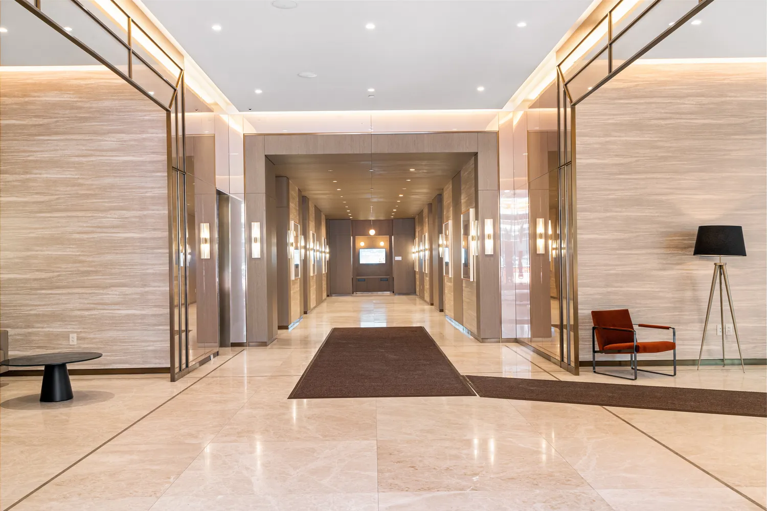 a view of a hallway with wooden floor