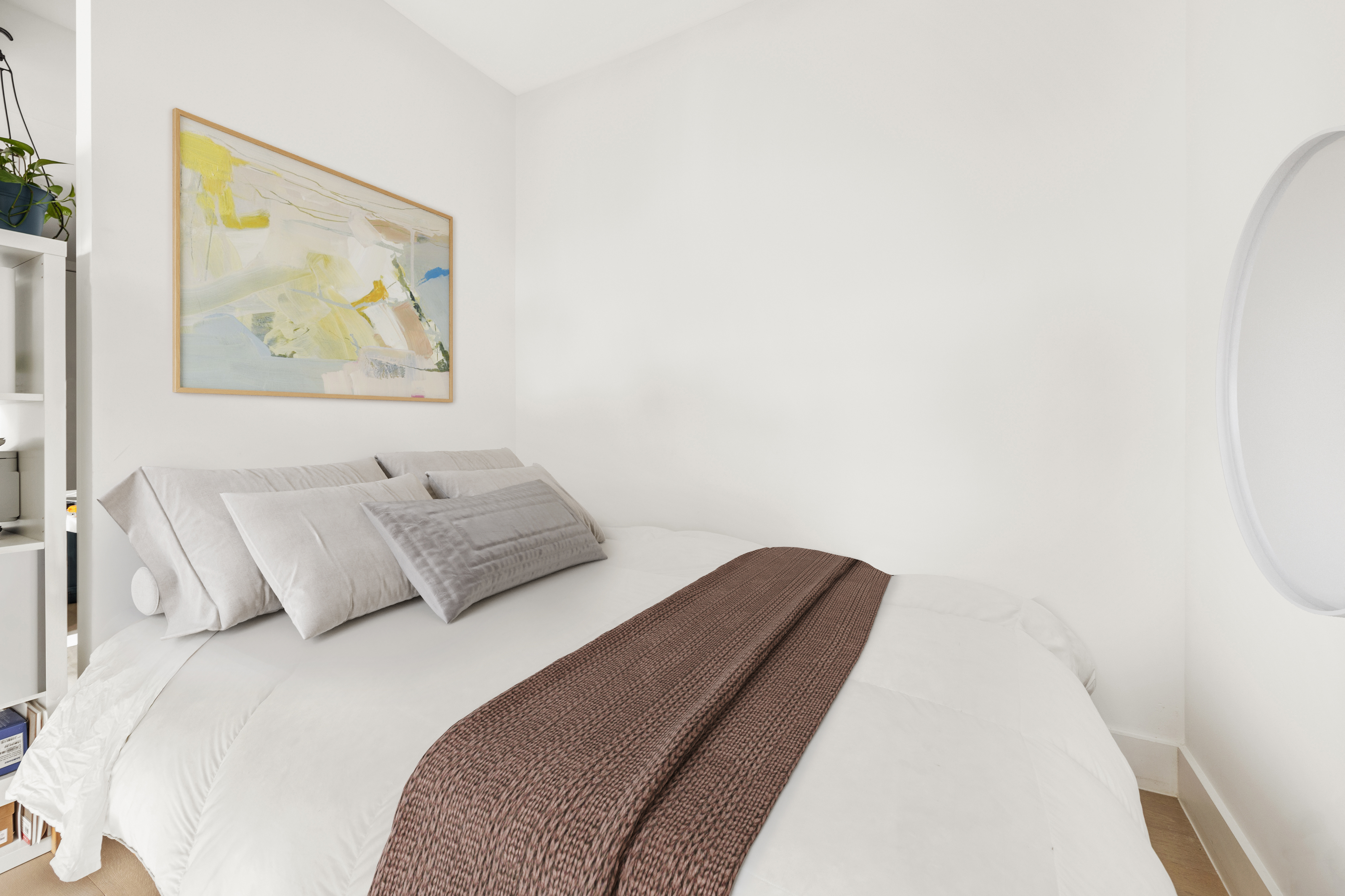 111 Montgomery Street, Unit 8Q Brooklyn, NY 11225 - Photo 3 of 11 a bedroom with a bed and painting on the wall