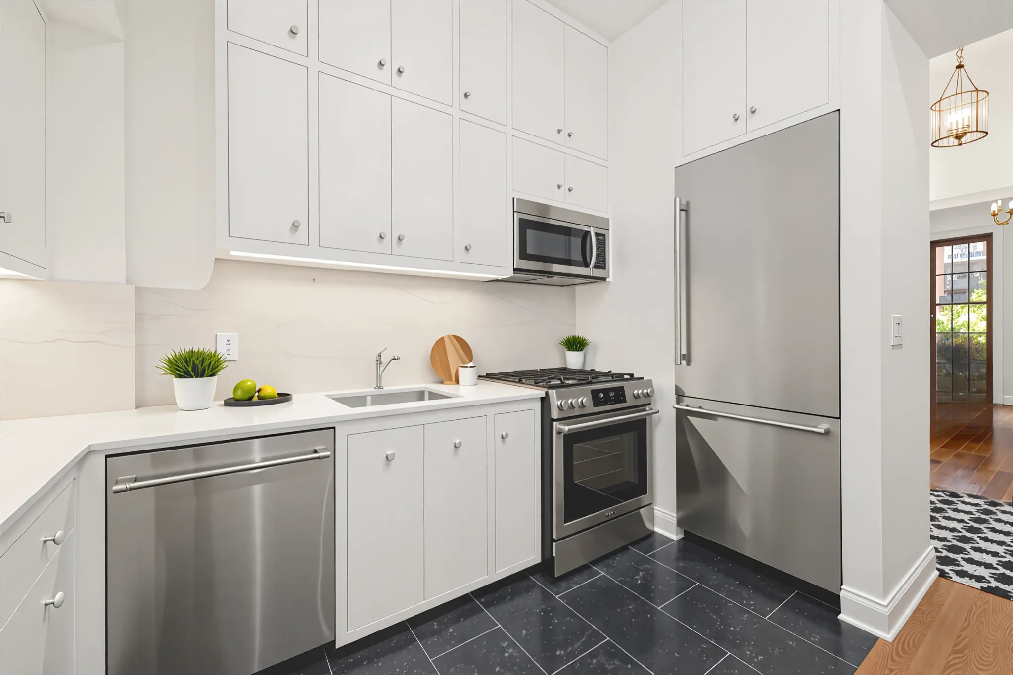 157 East 75th Street, Unit 1E Manhattan, NY 10021 - Photo 3 of 11 a kitchen with cabinets stainless steel appliances and a counter space