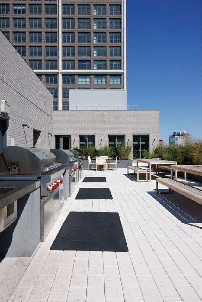 115 York Street, Unit PH20B Brooklyn, NY 11201 - Photo 12 of 21 a view of a patio with dining table and chairs with wooden floor