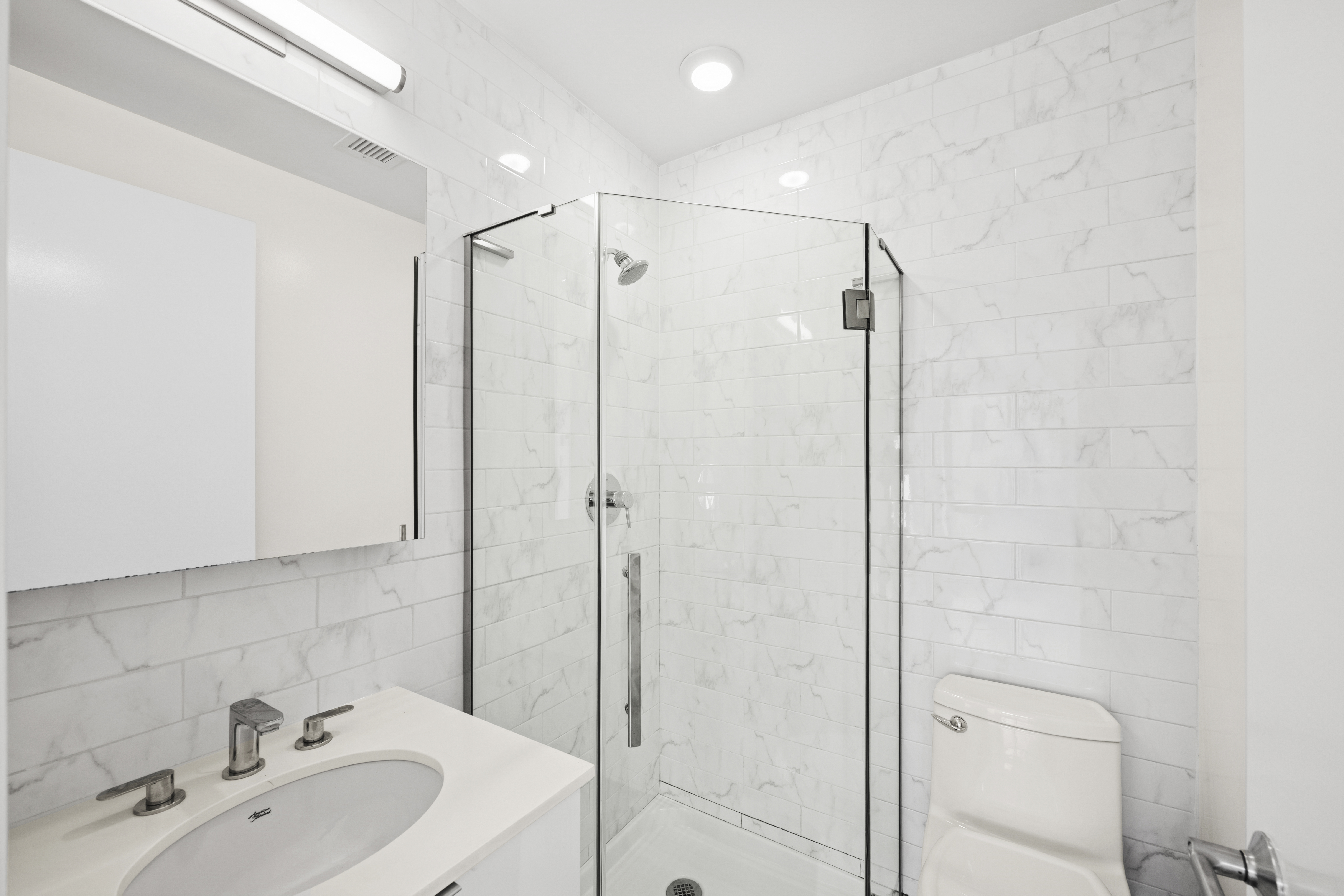 1164 Greene Avenue, Unit 3A Brooklyn, NY 11221 - Photo 6 of 11 a bathroom with a shower and a sink