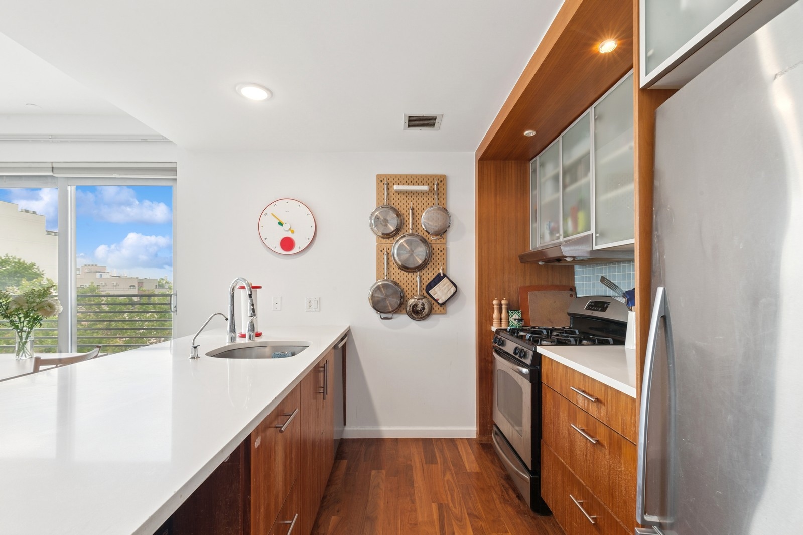 154 Skillman Avenue, Unit 5A Brooklyn, NY 11211 - Photo 3 of 11 a kitchen with stainless steel appliances granite countertop a sink and cabinets