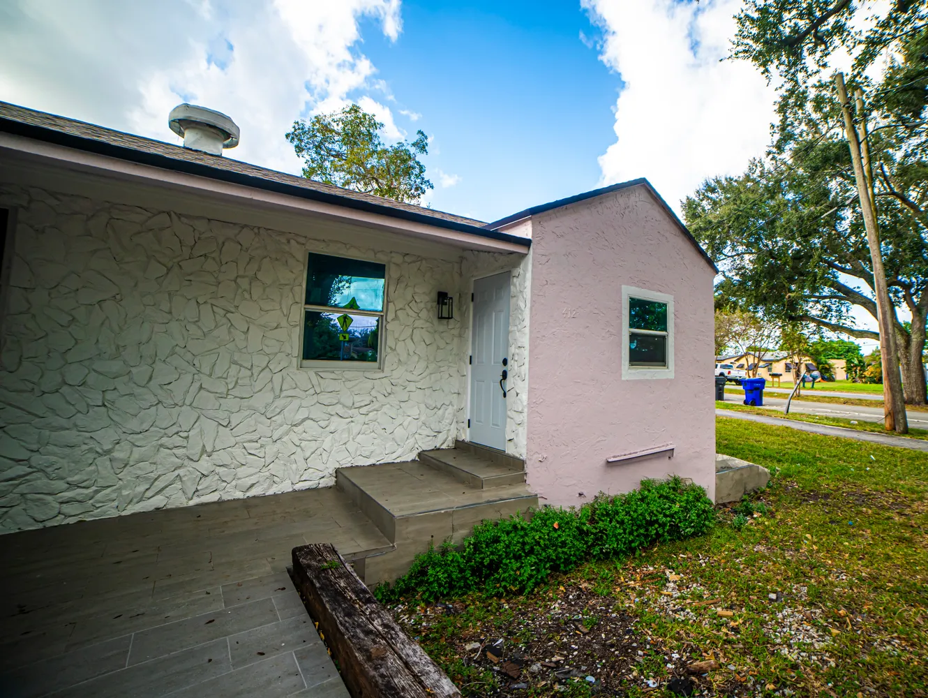 a front view of a house with garden