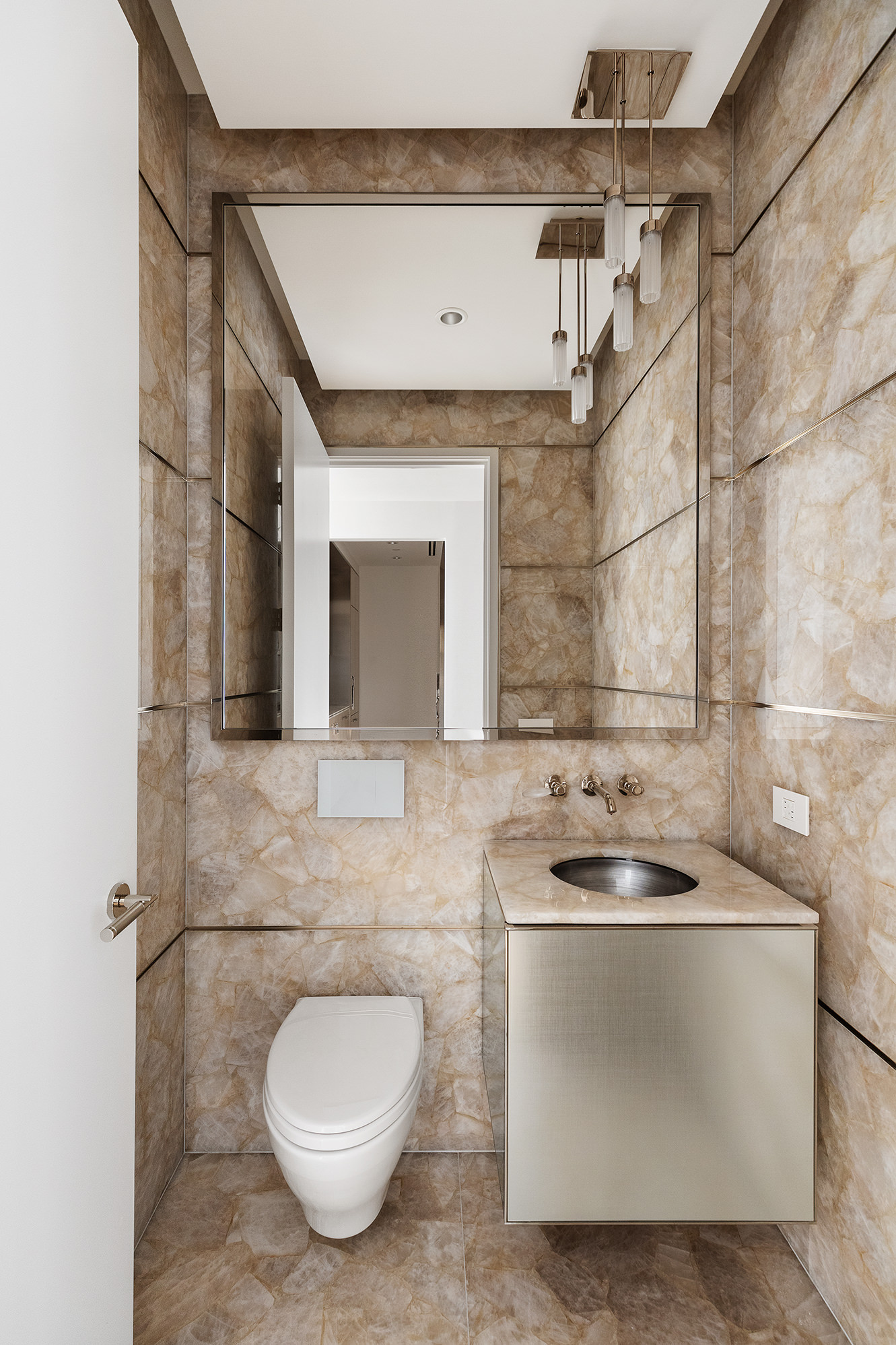 217 West 57th Street, Unit 57N Manhattan, NY 10019 - Photo 9 of 10 a bathroom with a sink and toilet