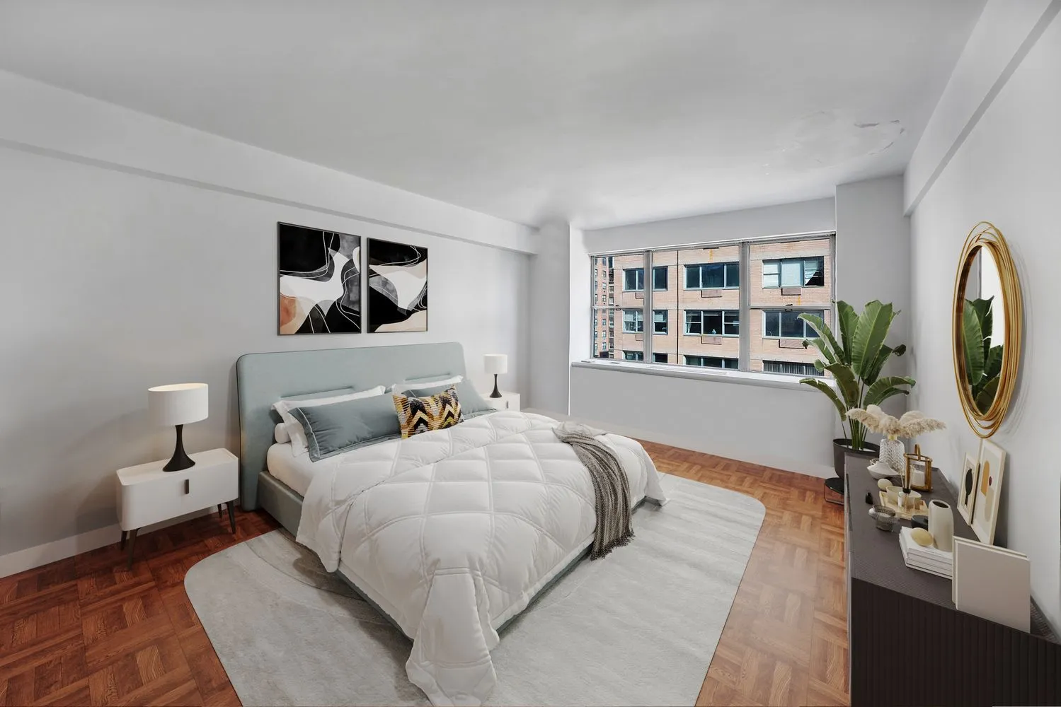 a bedroom with a large bed and a painting on the wall