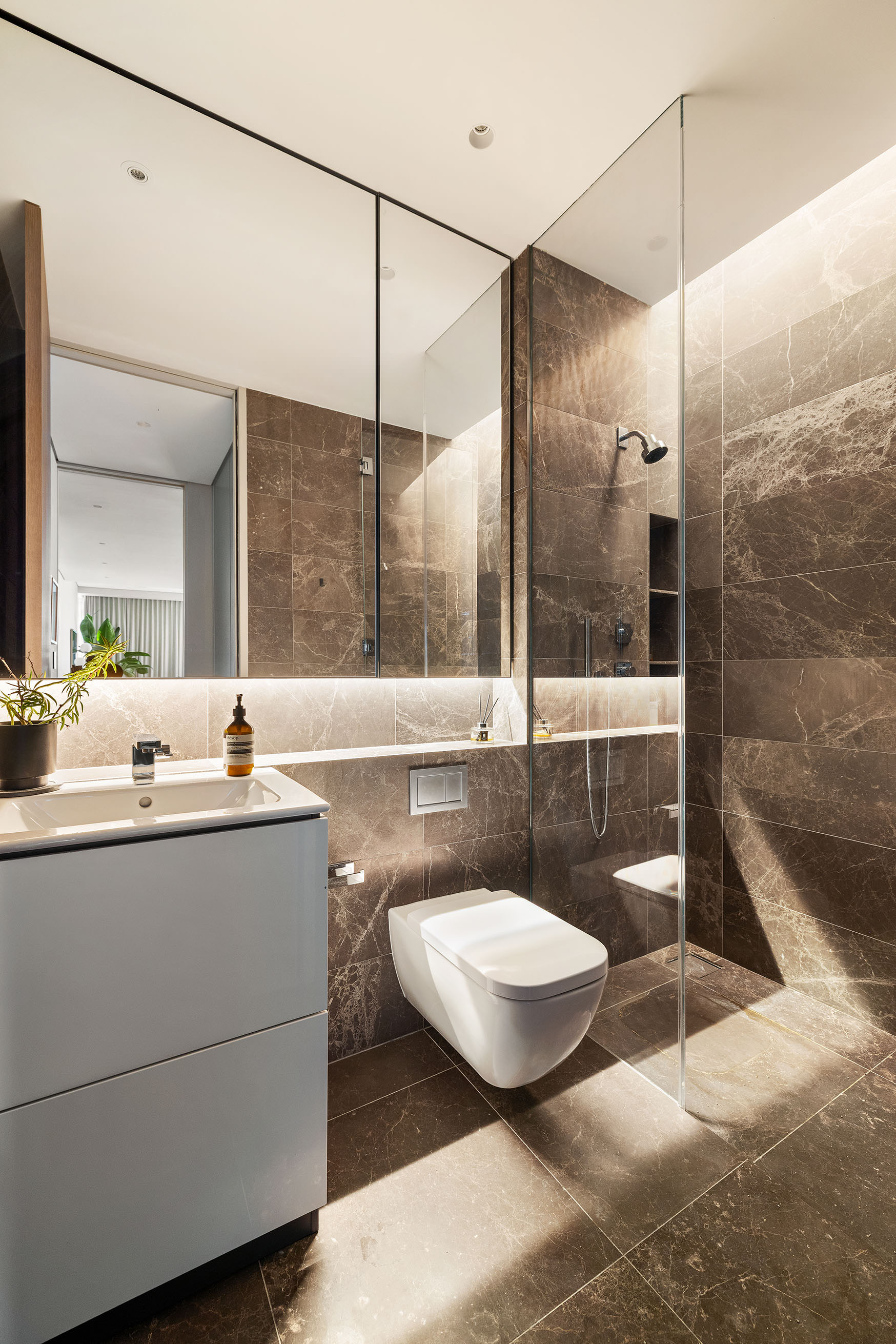 515 West 29th Street, Unit 2S Manhattan, NY 10001 - Photo 10 of 11 a bathroom with a sink a toilet a mirror and shower