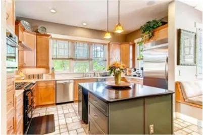 a kitchen with sink and window