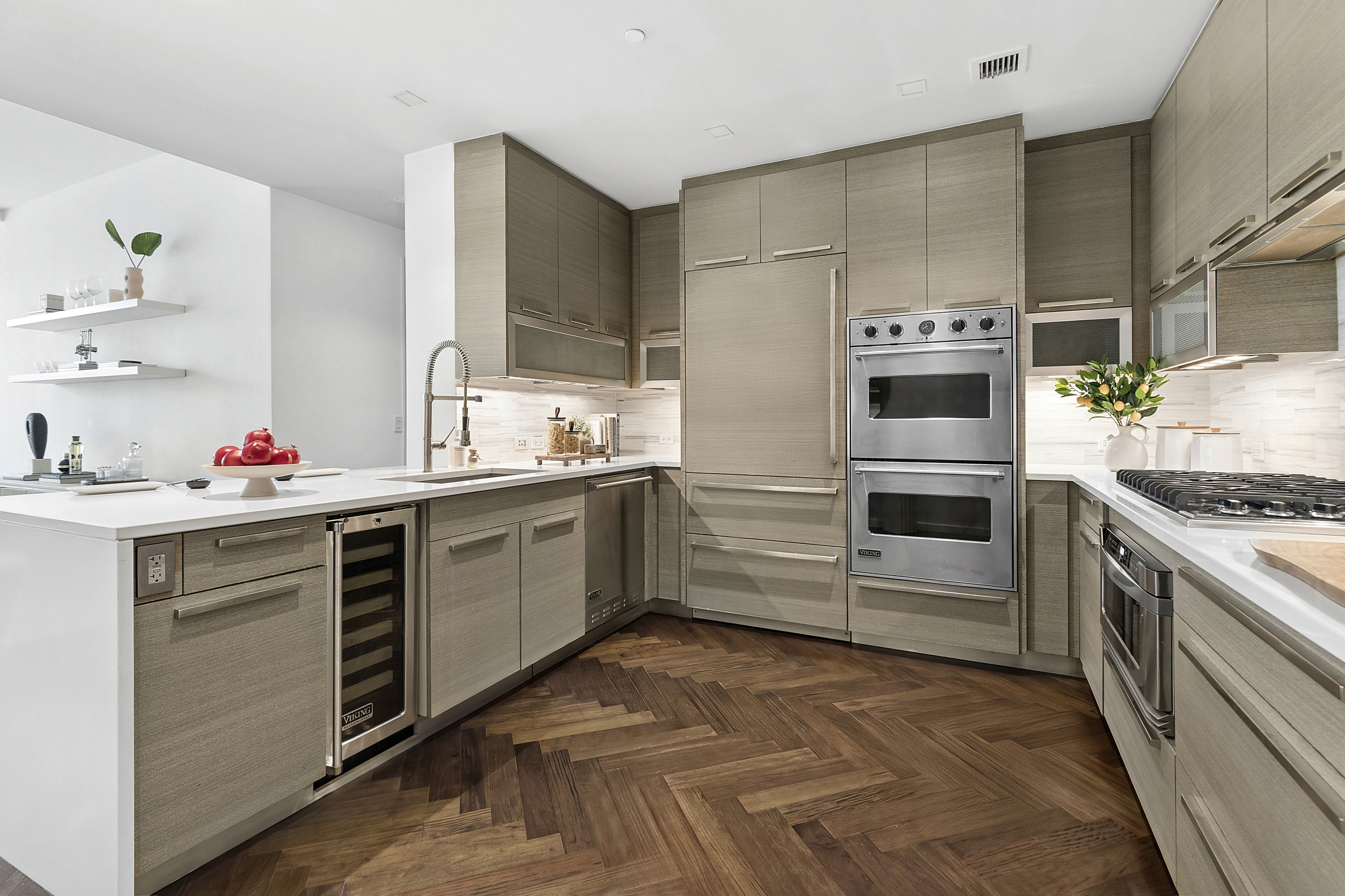 400 West 12th Street, Unit 3E Manhattan, NY 10014 - Photo 4 of 11 a kitchen with stainless steel appliances a stove a sink and a refrigerator