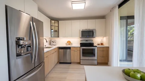 a kitchen with a refrigerator stove and microwave