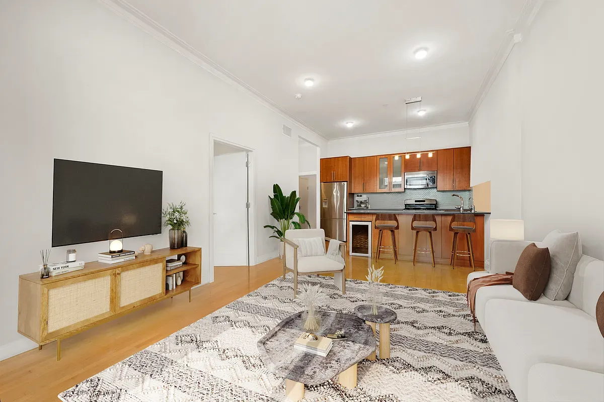 a living room with fireplace furniture and a flat screen tv
