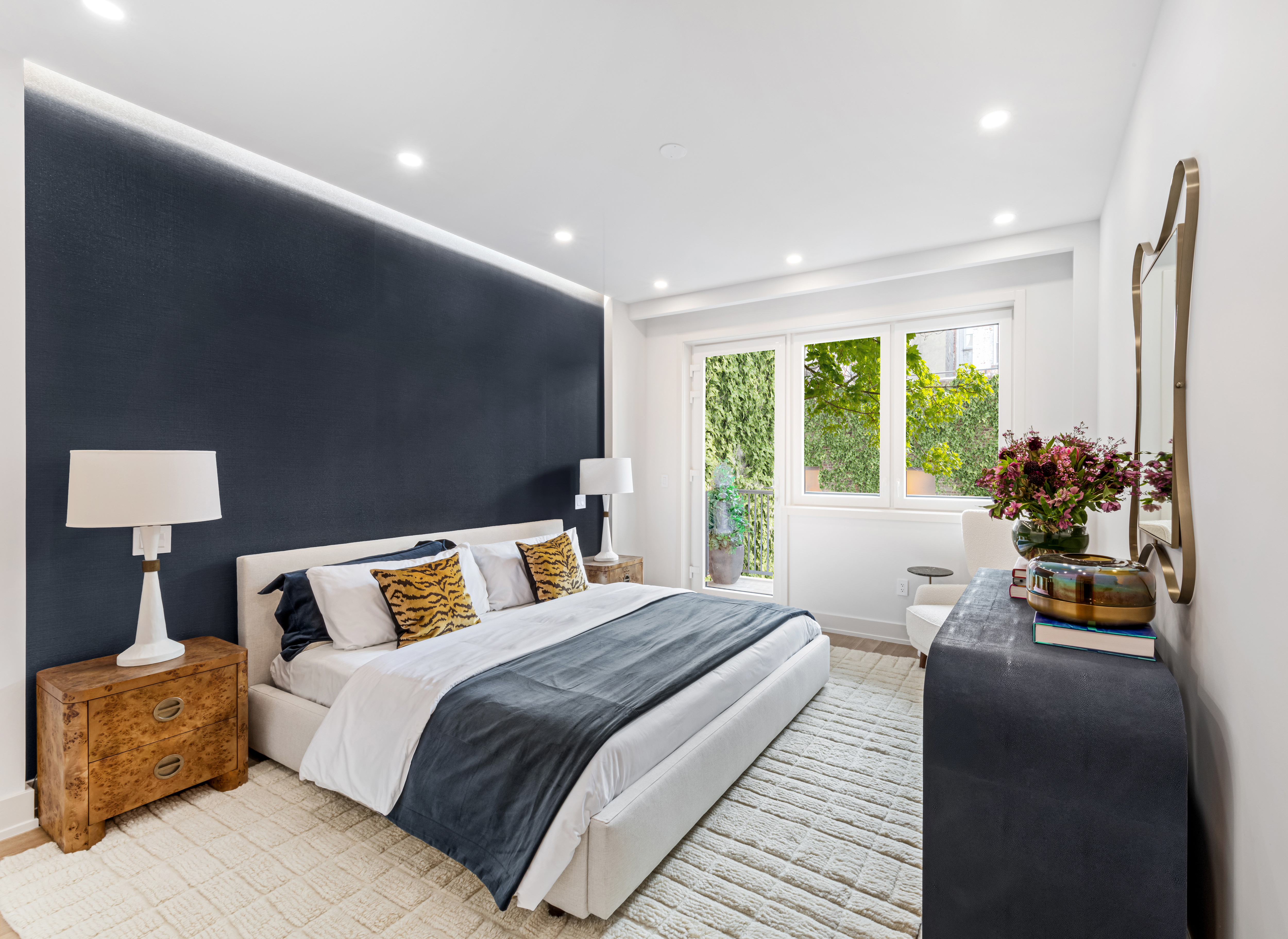 420 East 75th Street, Unit 2 Manhattan, NY 10021 - Photo 7 of 25 a bedroom with a bed and a couch