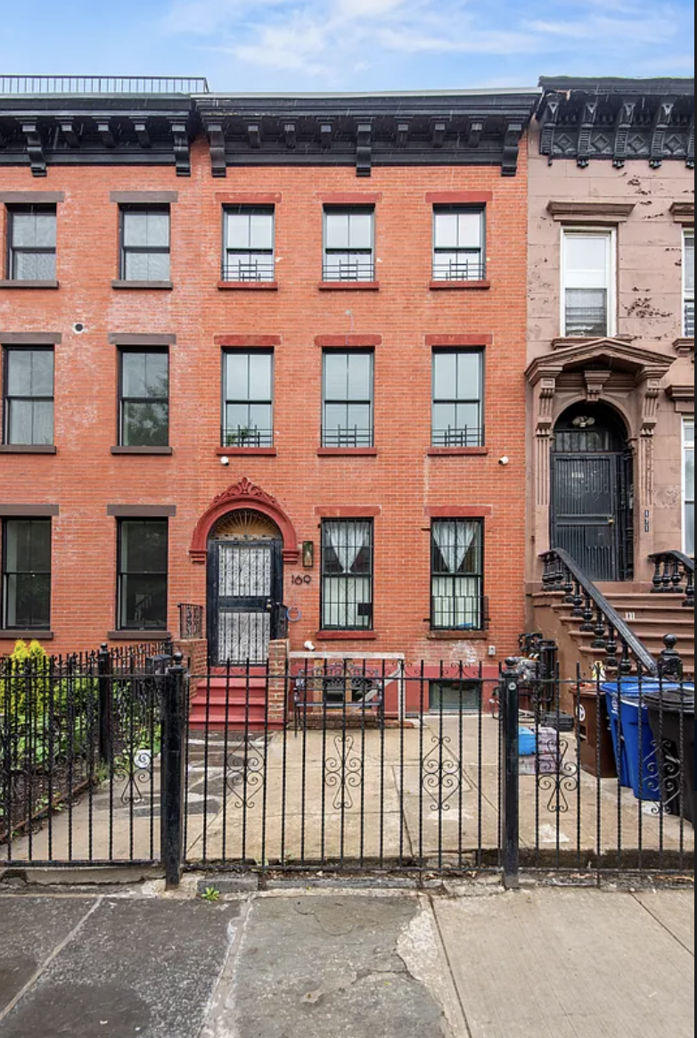 169 Putnam Avenue, Unit 2 Brooklyn, NY 11216 - Photo 9 of 10 a front view of a house with a parking area
