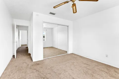 an aerial view of a house with a swimming pool yard and outdoor seating