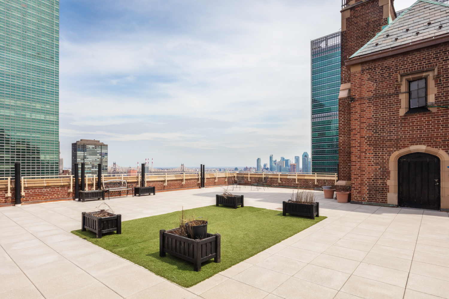45 Tudor City Place, Unit 418 Manhattan, NY 10017 - Photo 10 of 11 a swimming pool with outdoor seating and barbeque oven